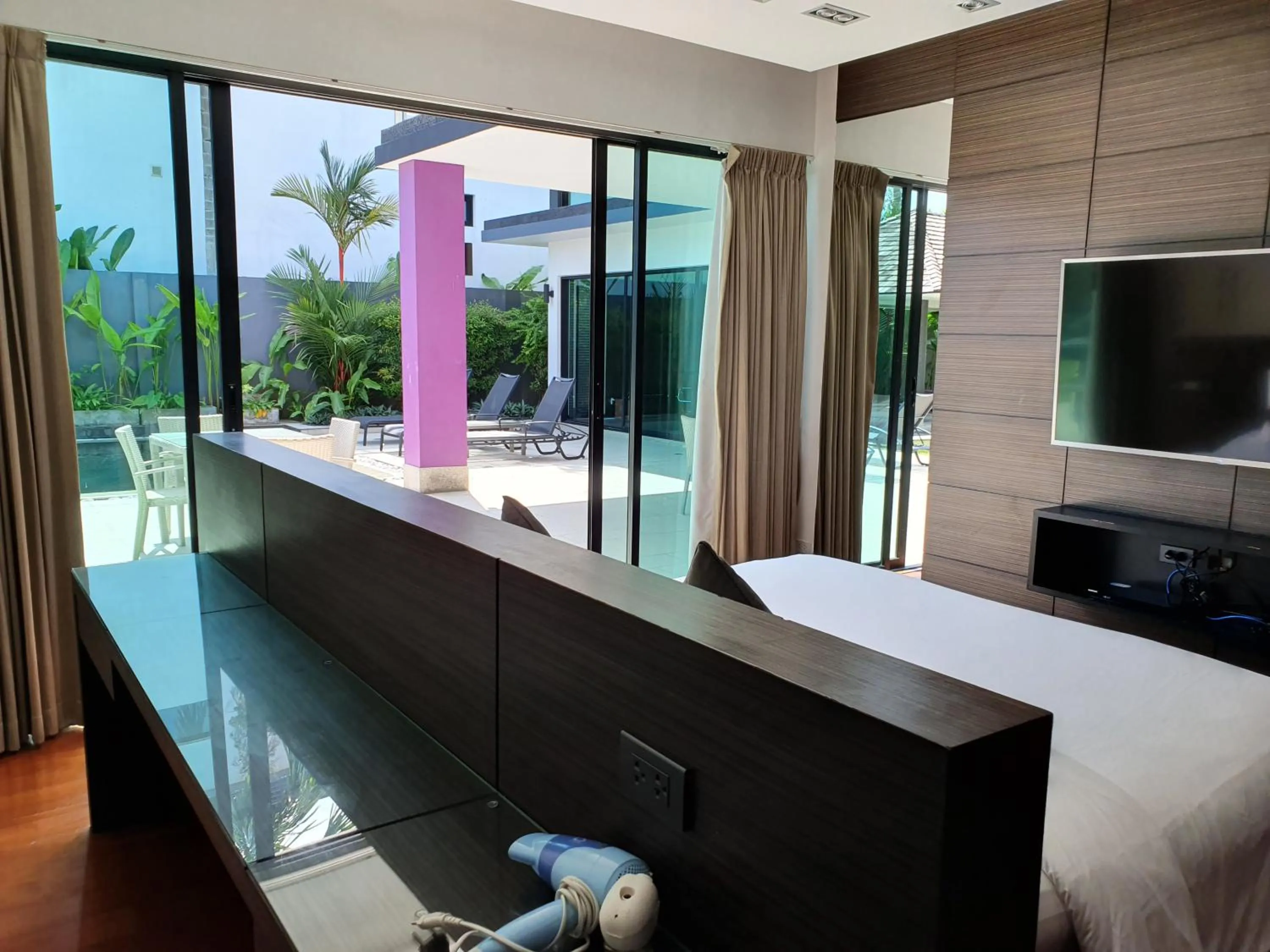 Pool view, Bed in Eden Villa Phuket