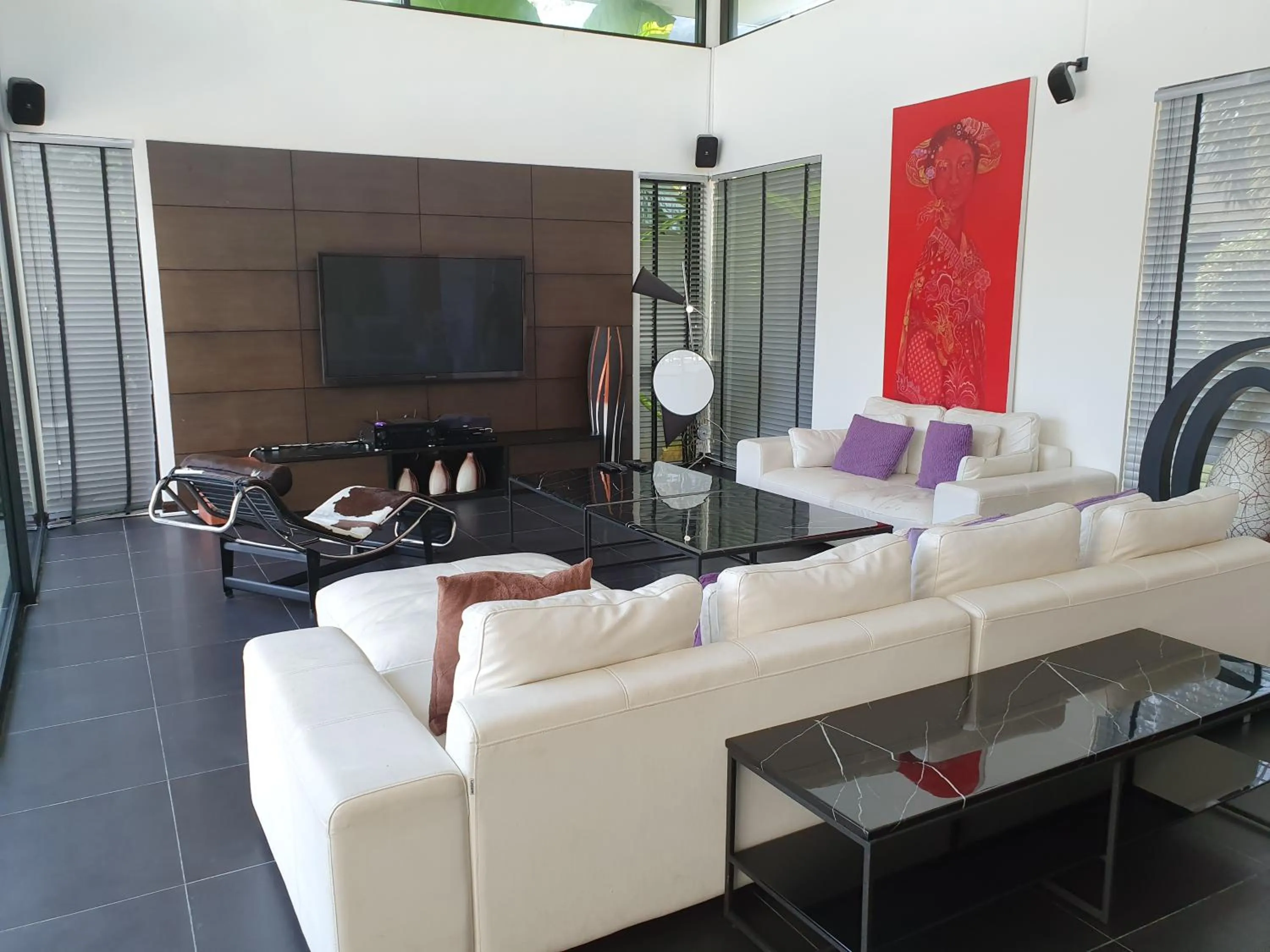 Communal lounge/ TV room in Eden Villa Phuket