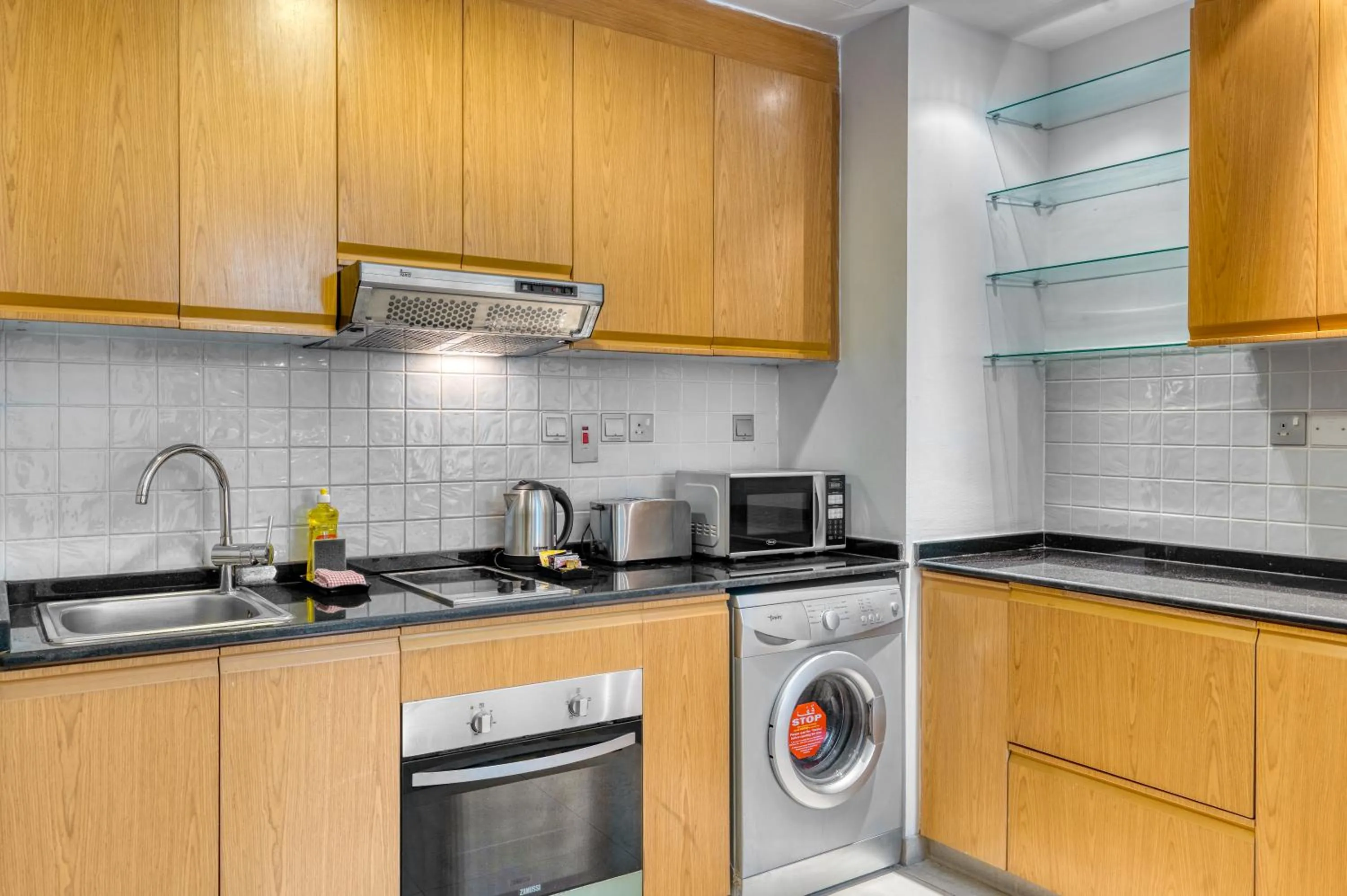 Kitchen or kitchenette in Grand Heights Dubai Hotel Apartments