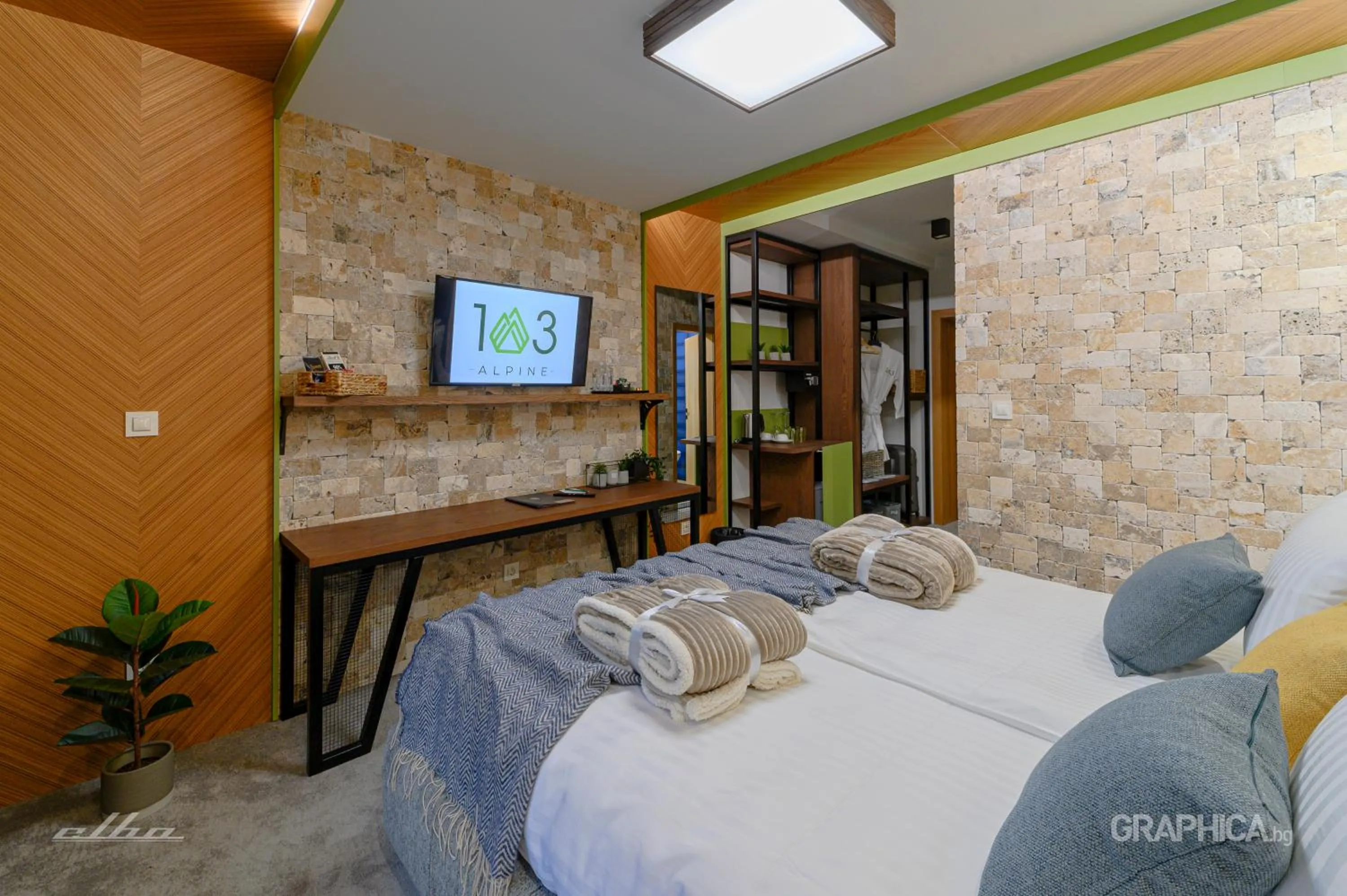 Bed in 103 Alpine Hotel