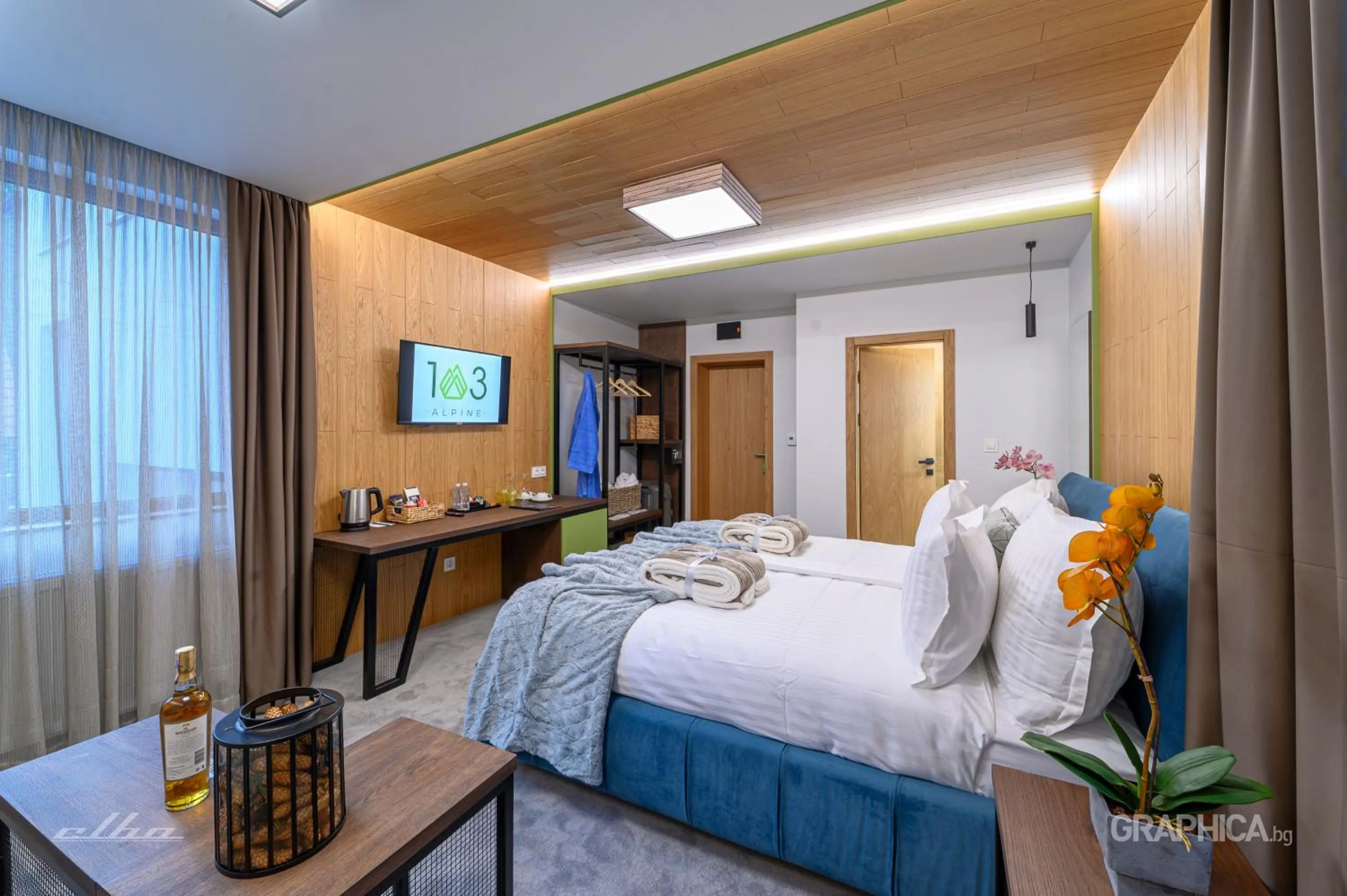 Bed in 103 Alpine Hotel