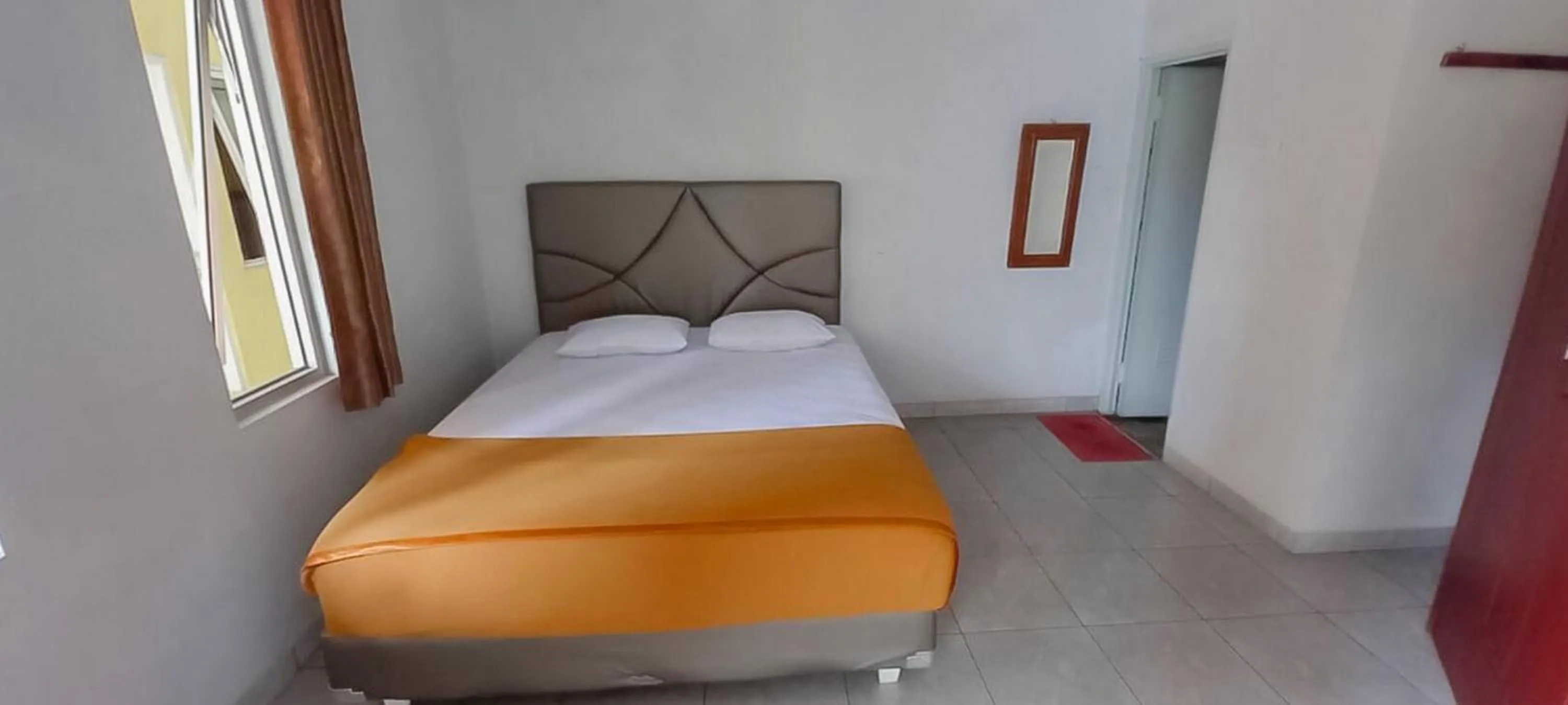 Bedroom, Bed in Hotel Sri Indrawati Puncak Mitra RedDoorz