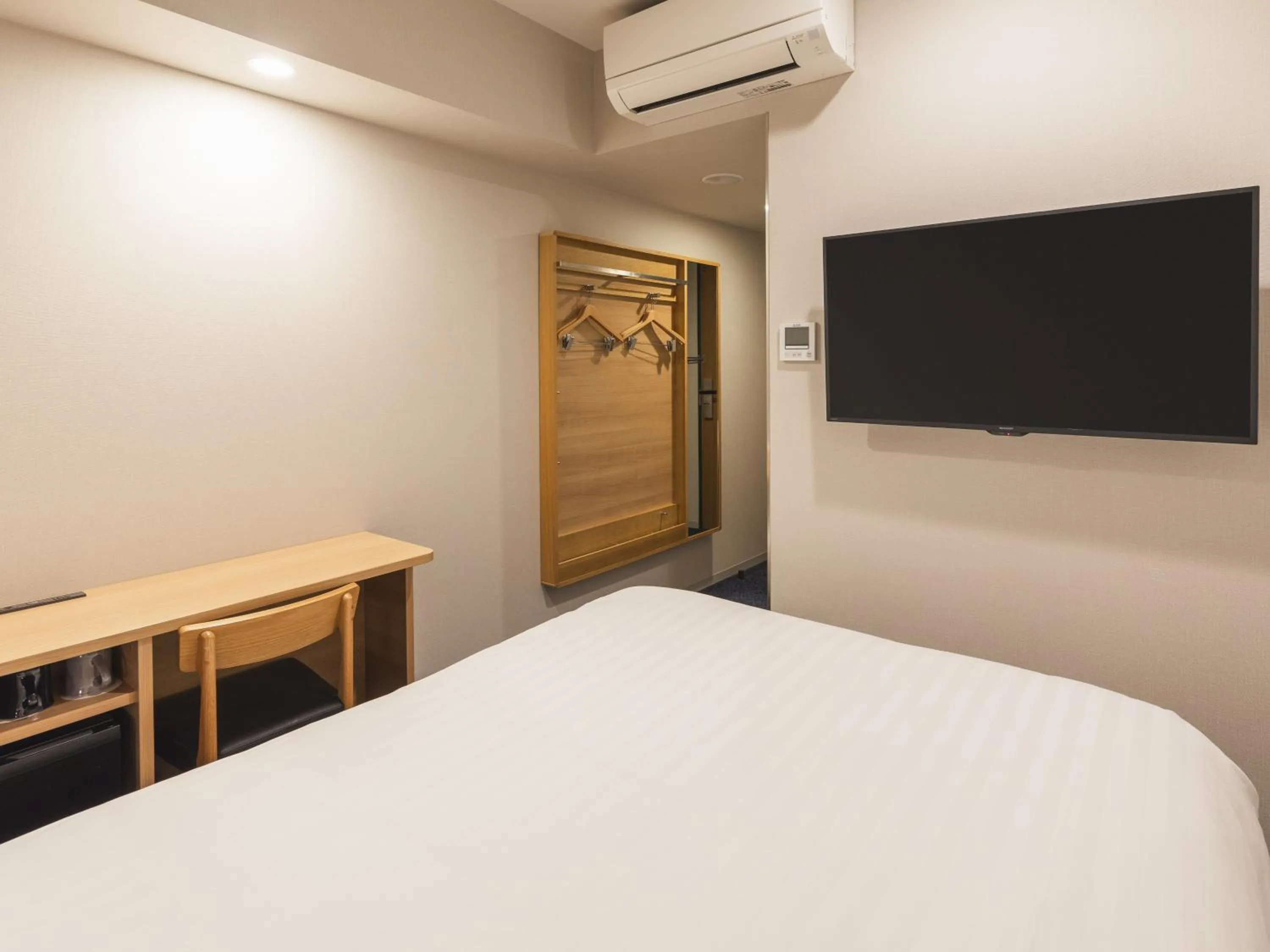 Bed in Sotetsu Fresa Inn Hiroshima