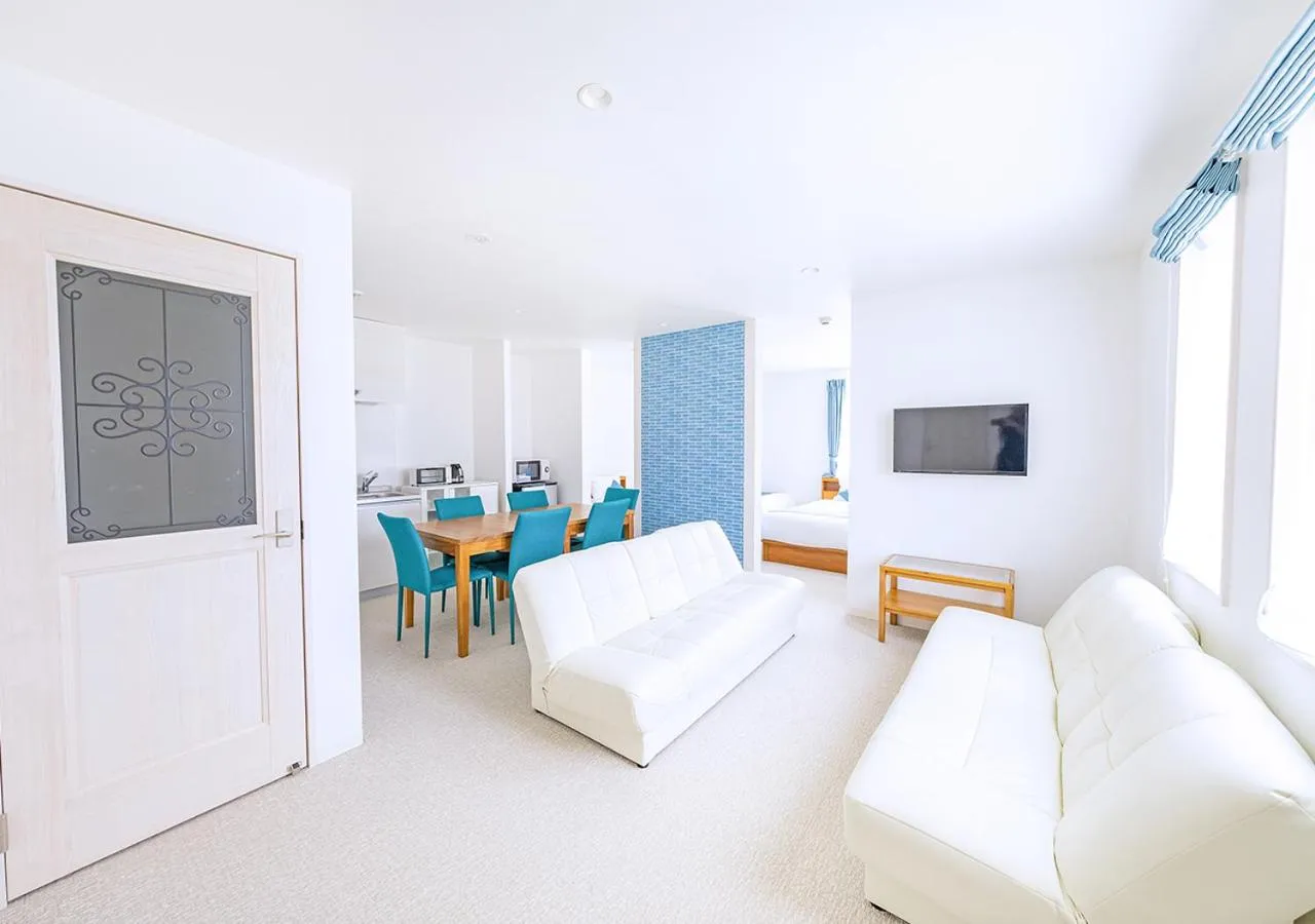 Living room, Bed in Hotel California Miyakojima Resort