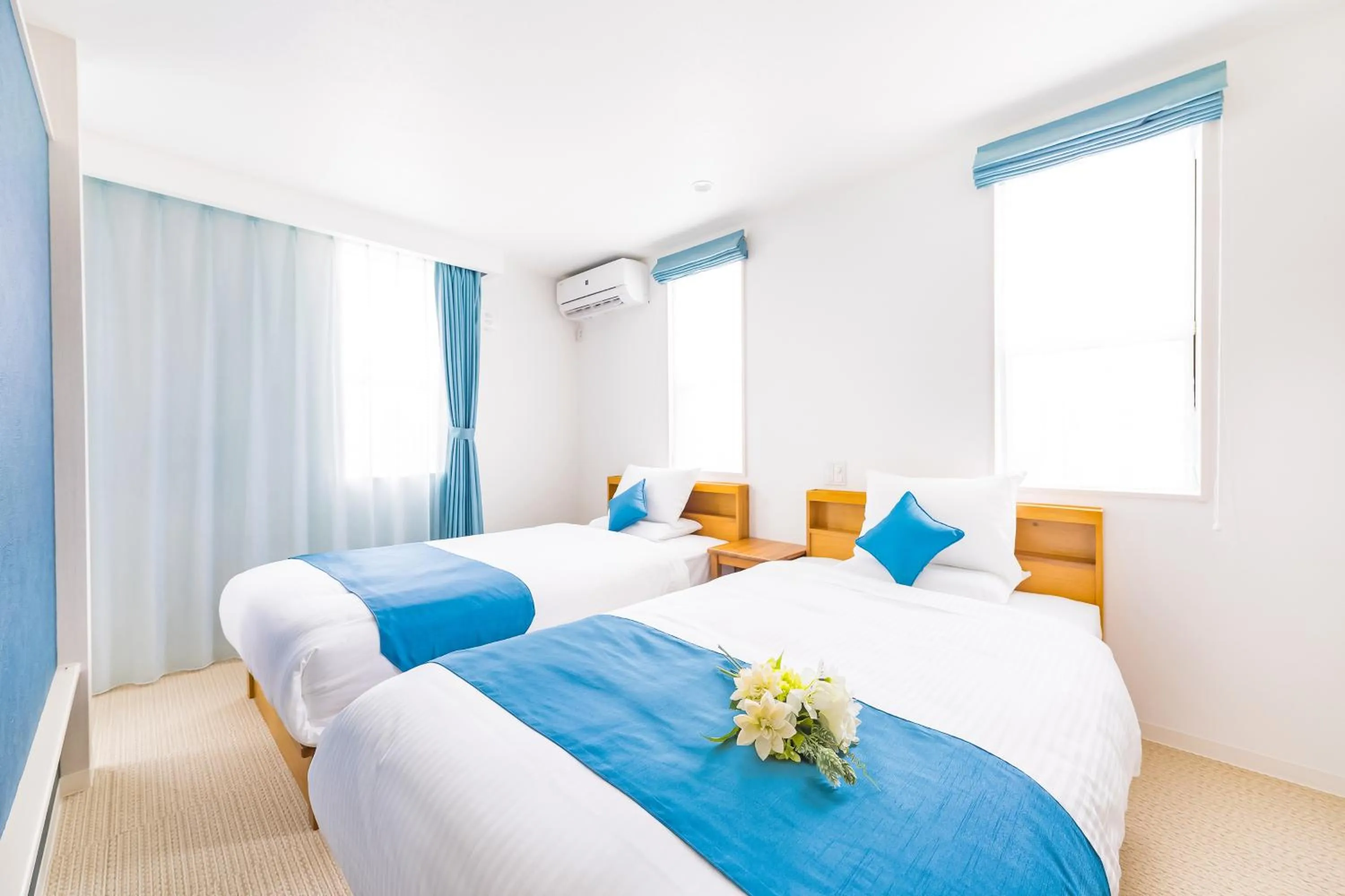 Bed in Hotel California Miyakojima Resort