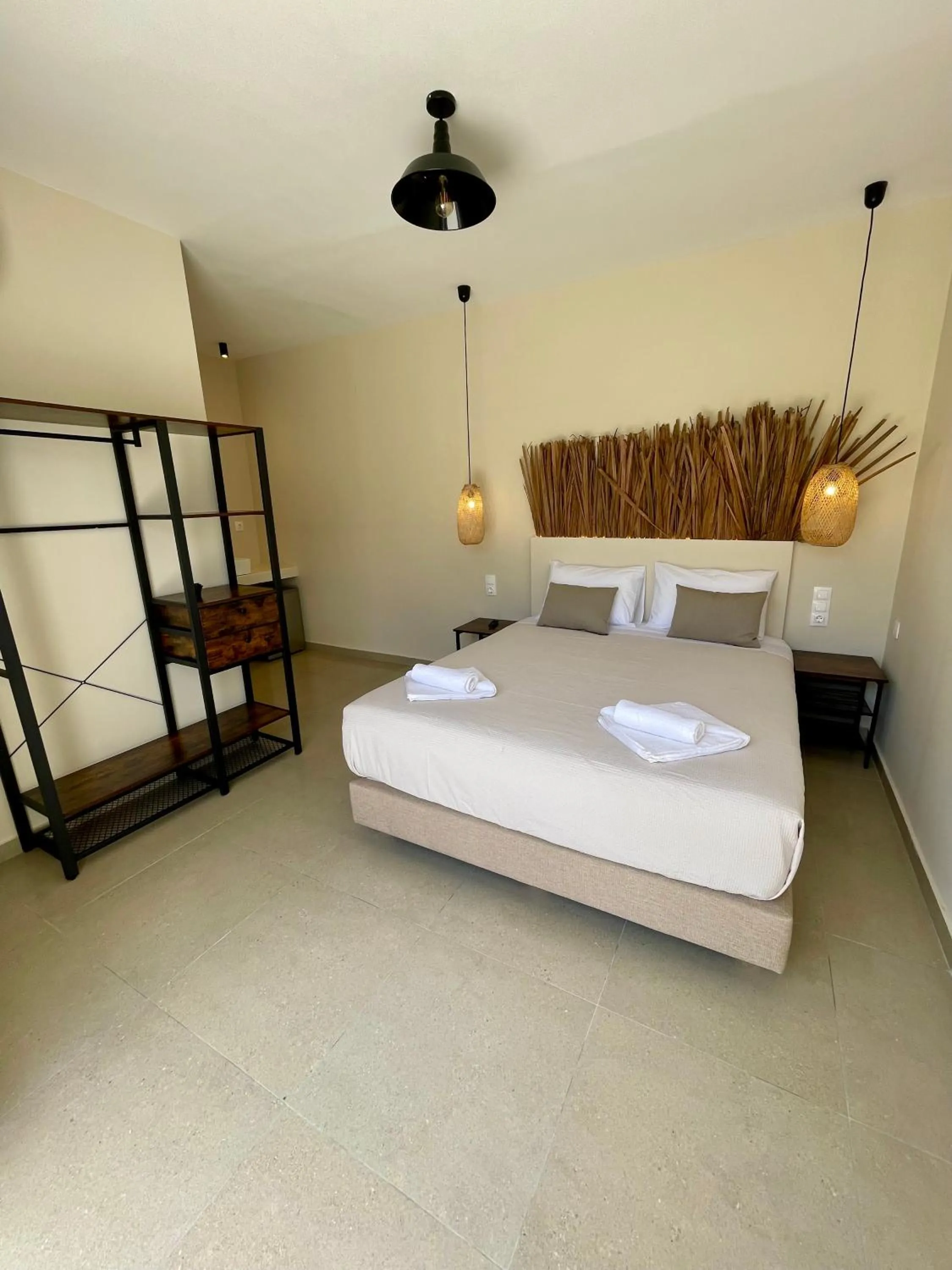Bed in Atma Beach Rooms & Suites