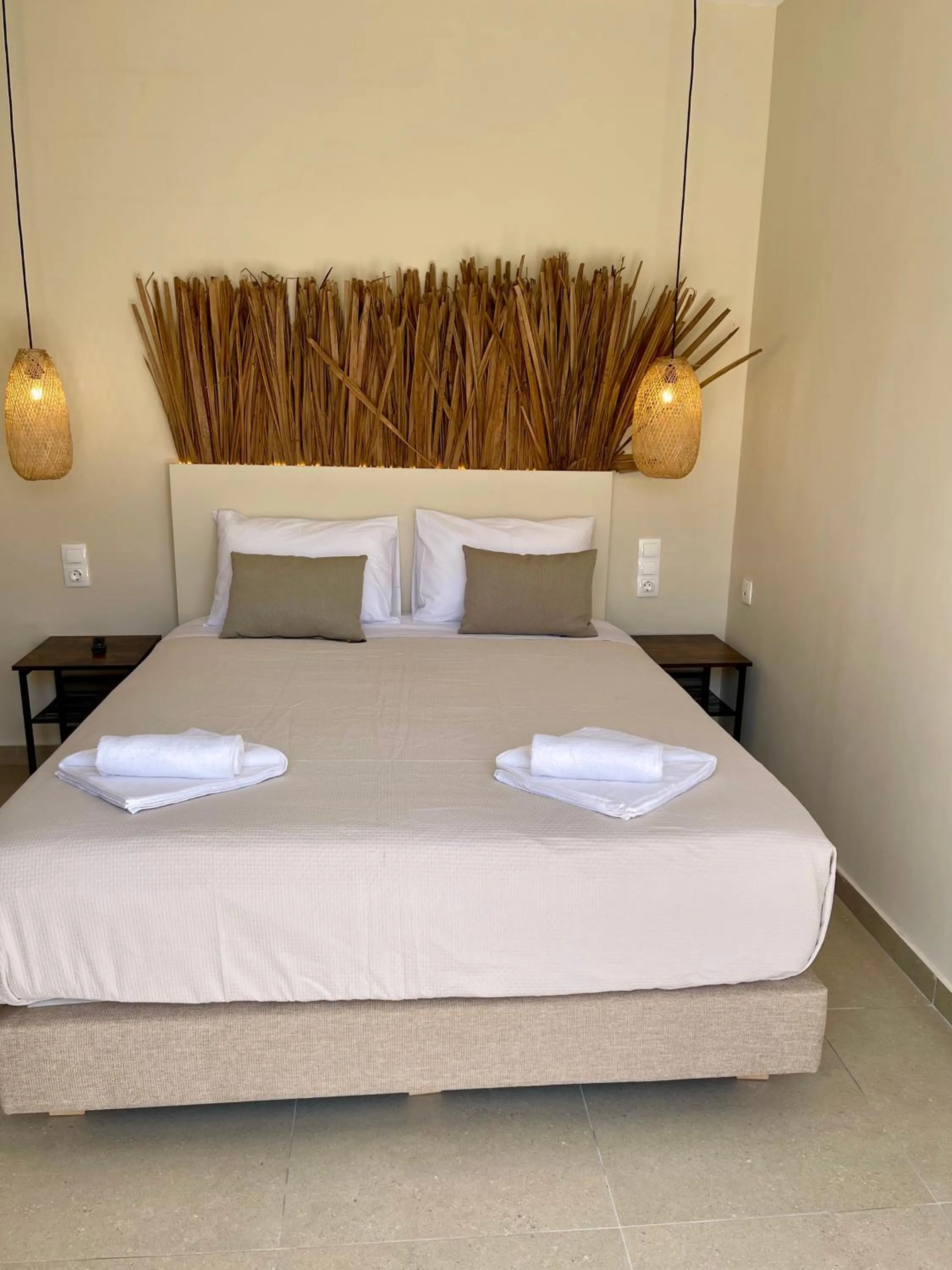 Bed in Atma Beach Rooms & Suites