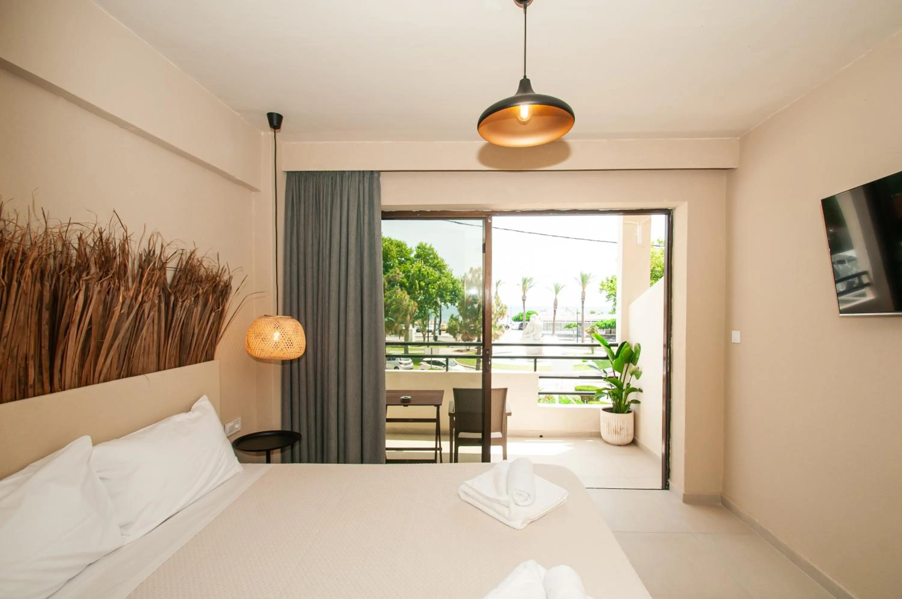 Bed in Atma Beach Rooms & Suites