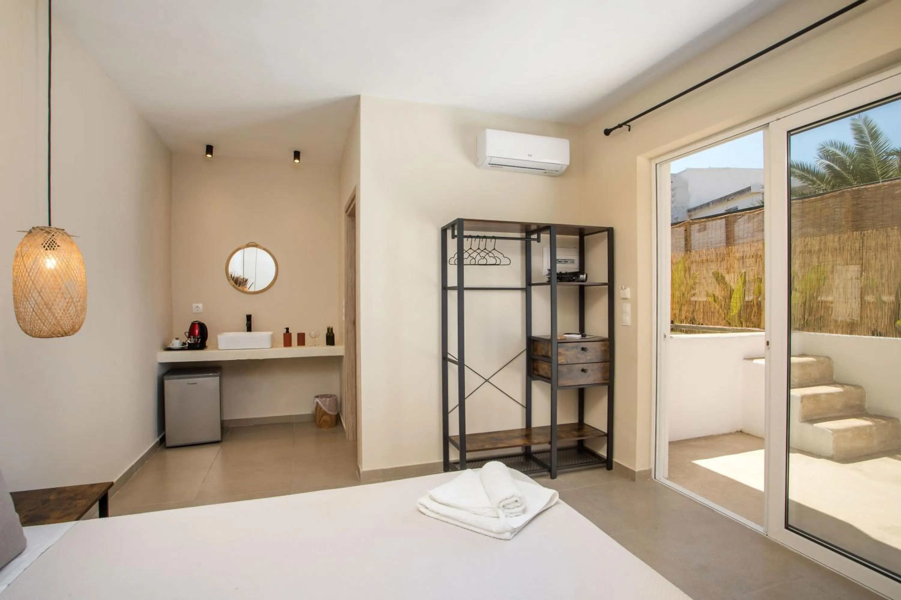 Bed in Atma Beach Rooms & Suites