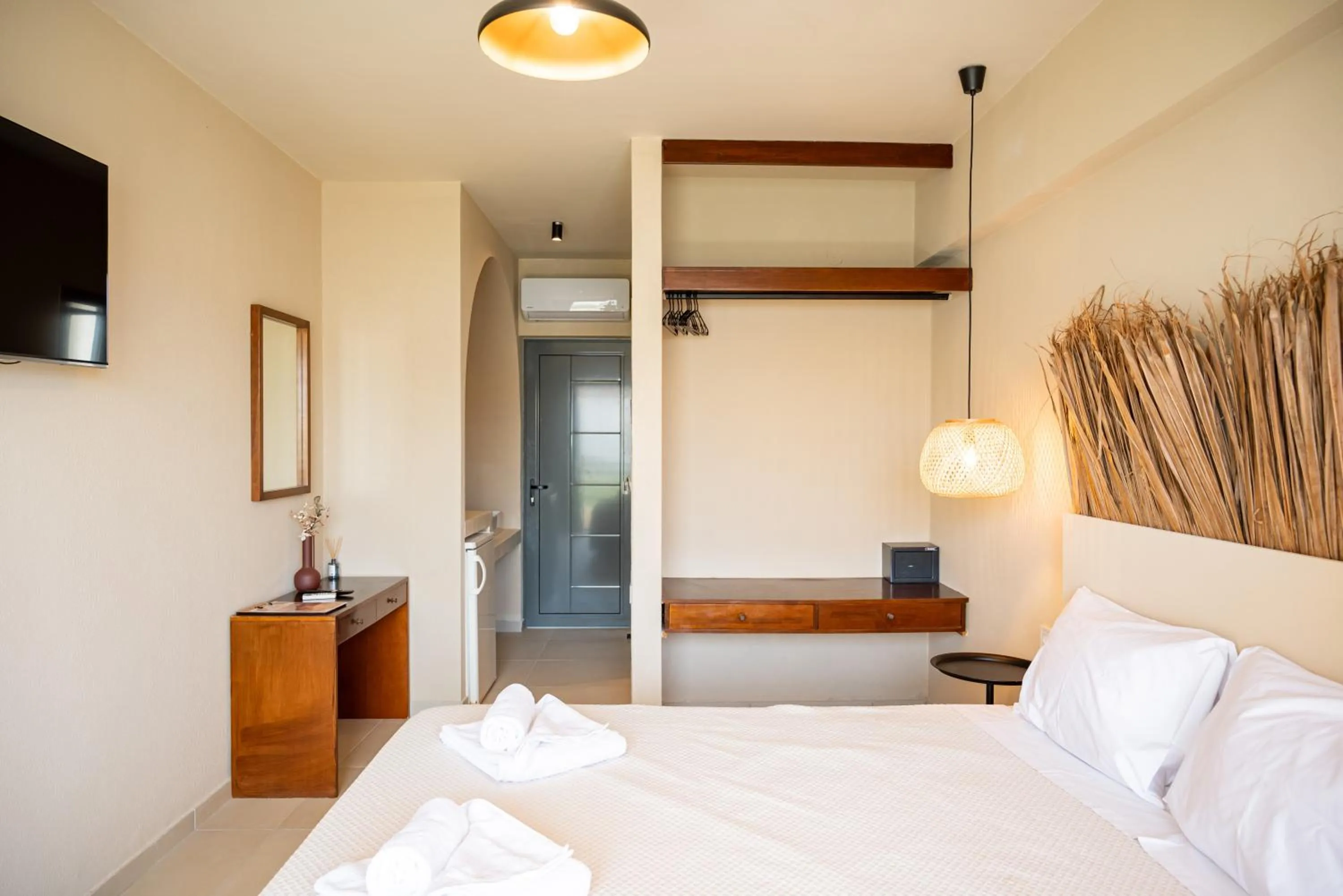 Bed in Atma Beach Rooms & Suites