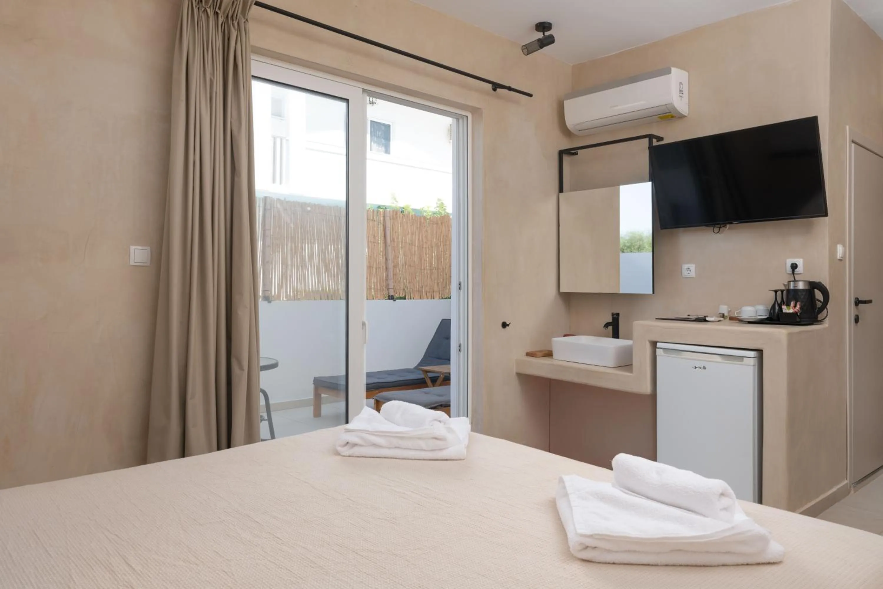 Bed in Atma Beach Rooms & Suites