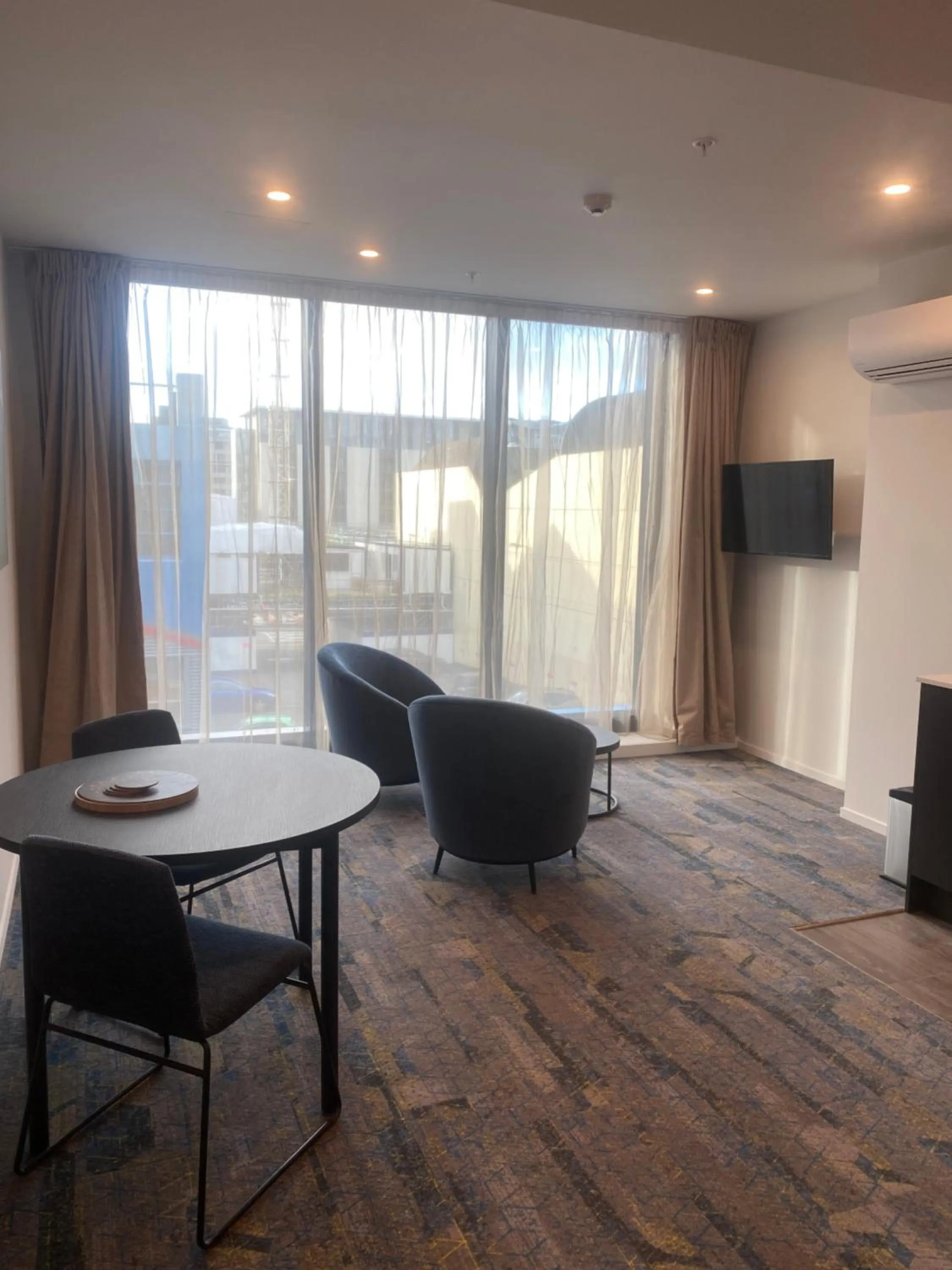 Living room in Ramada by Wyndham Wellington Taranaki Street