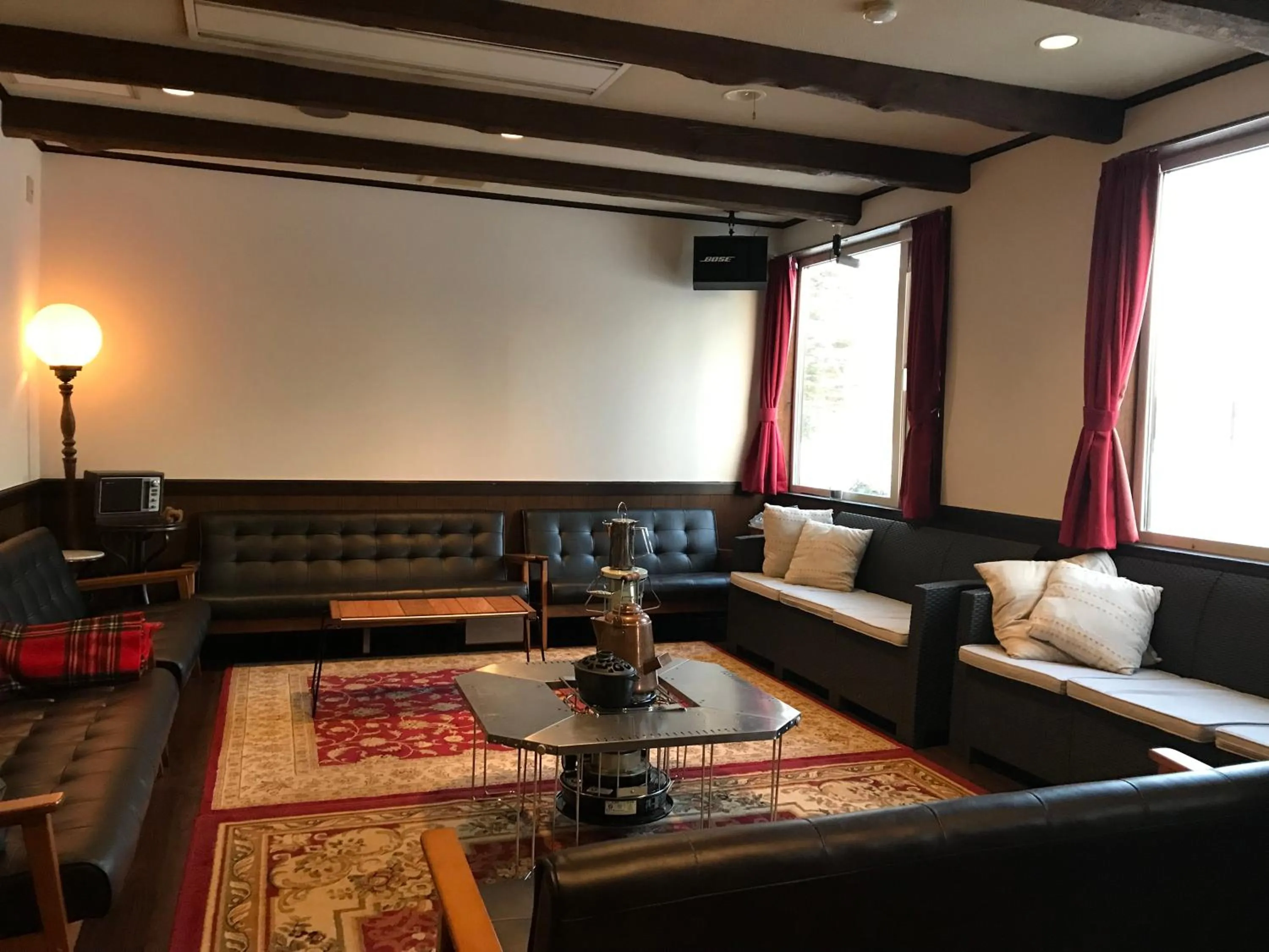 Communal lounge/ TV room in Lakeside Hotels Kuore