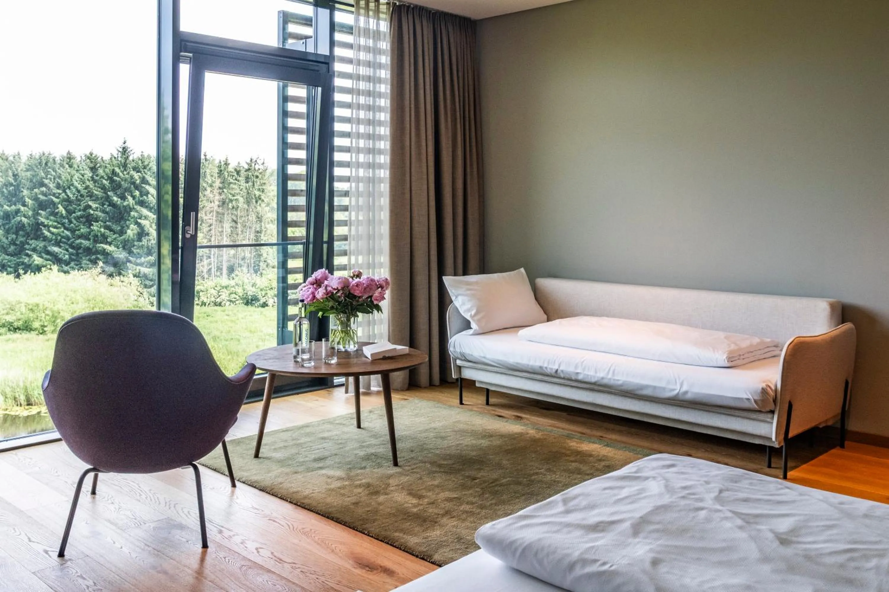 Seating area, Bed in Hotel Breitenburg