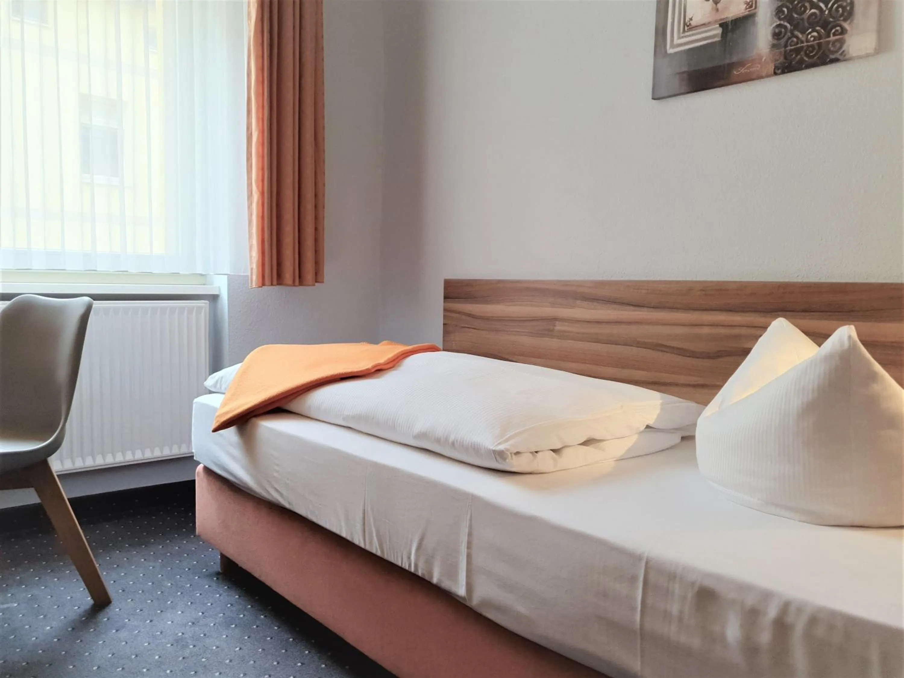 Bed in Melarose Feng Shui Hotel