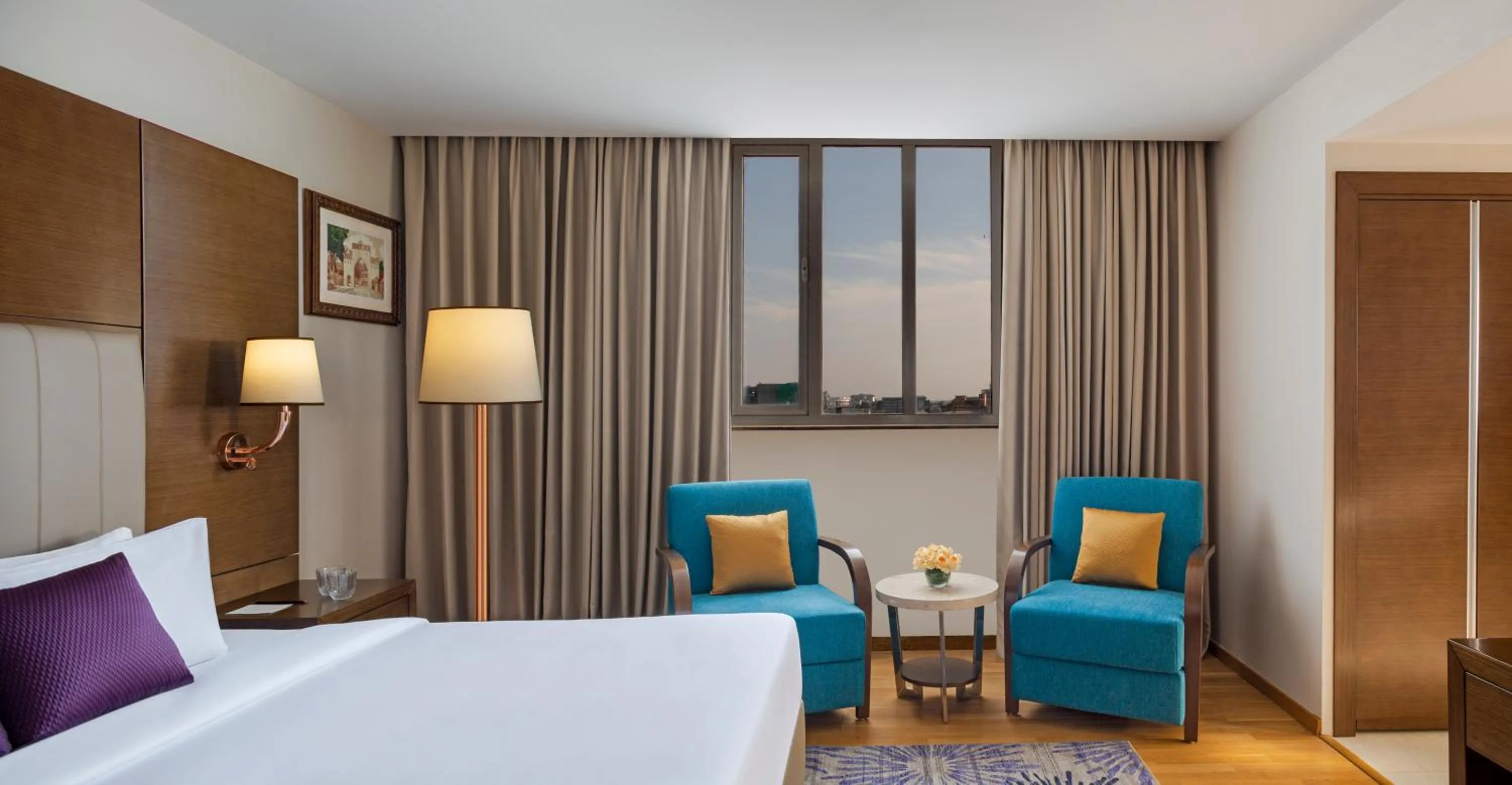 Seating area, Bed in Vivanta Thiruvananthapuram