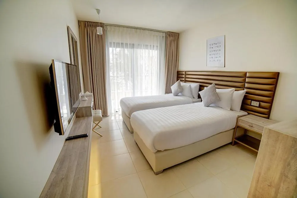 Communal lounge/ TV room, Bed in Sea view hotel