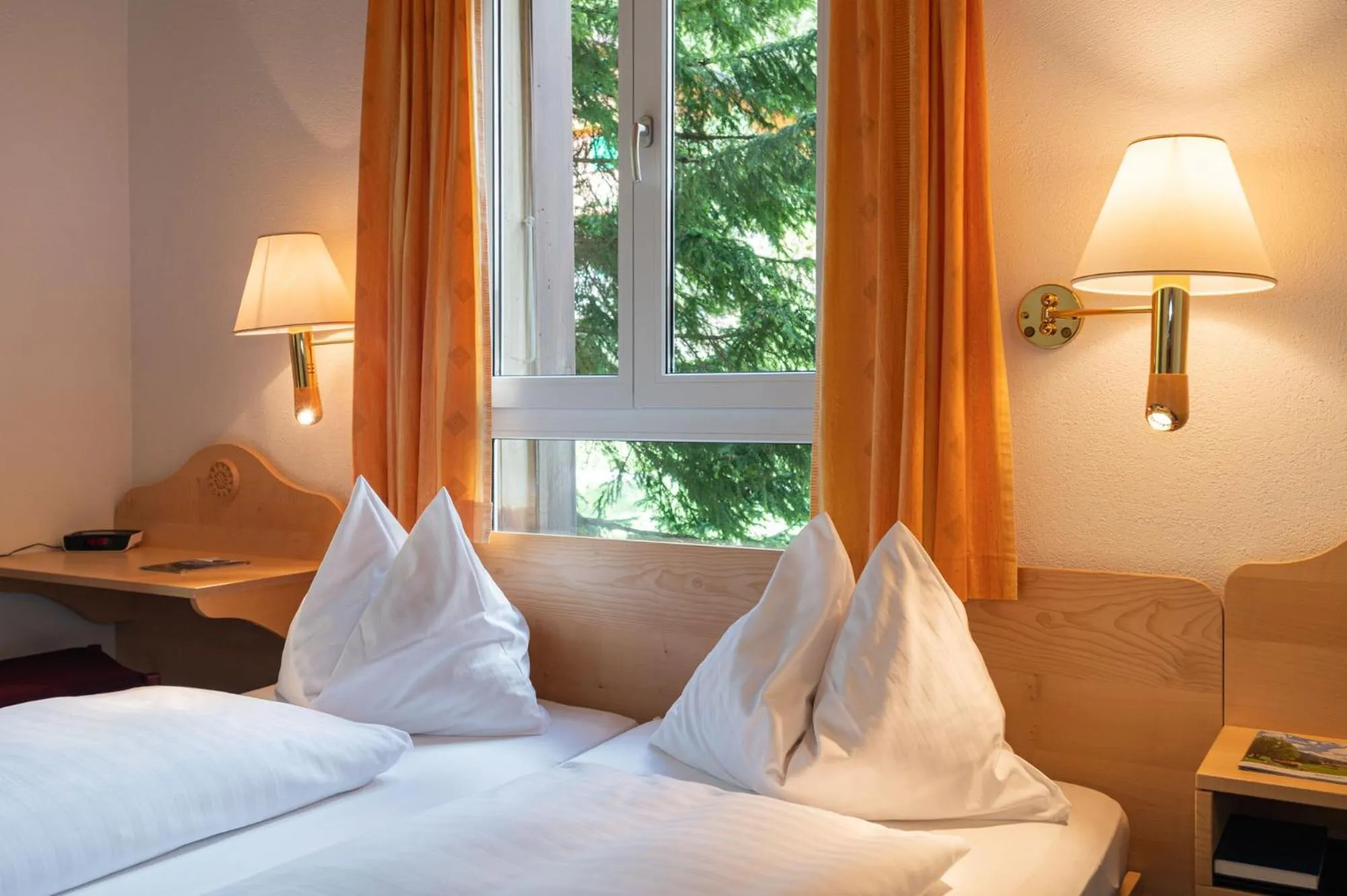 Bed in Hotel Bellevue - Traditional Swiss Hideaway