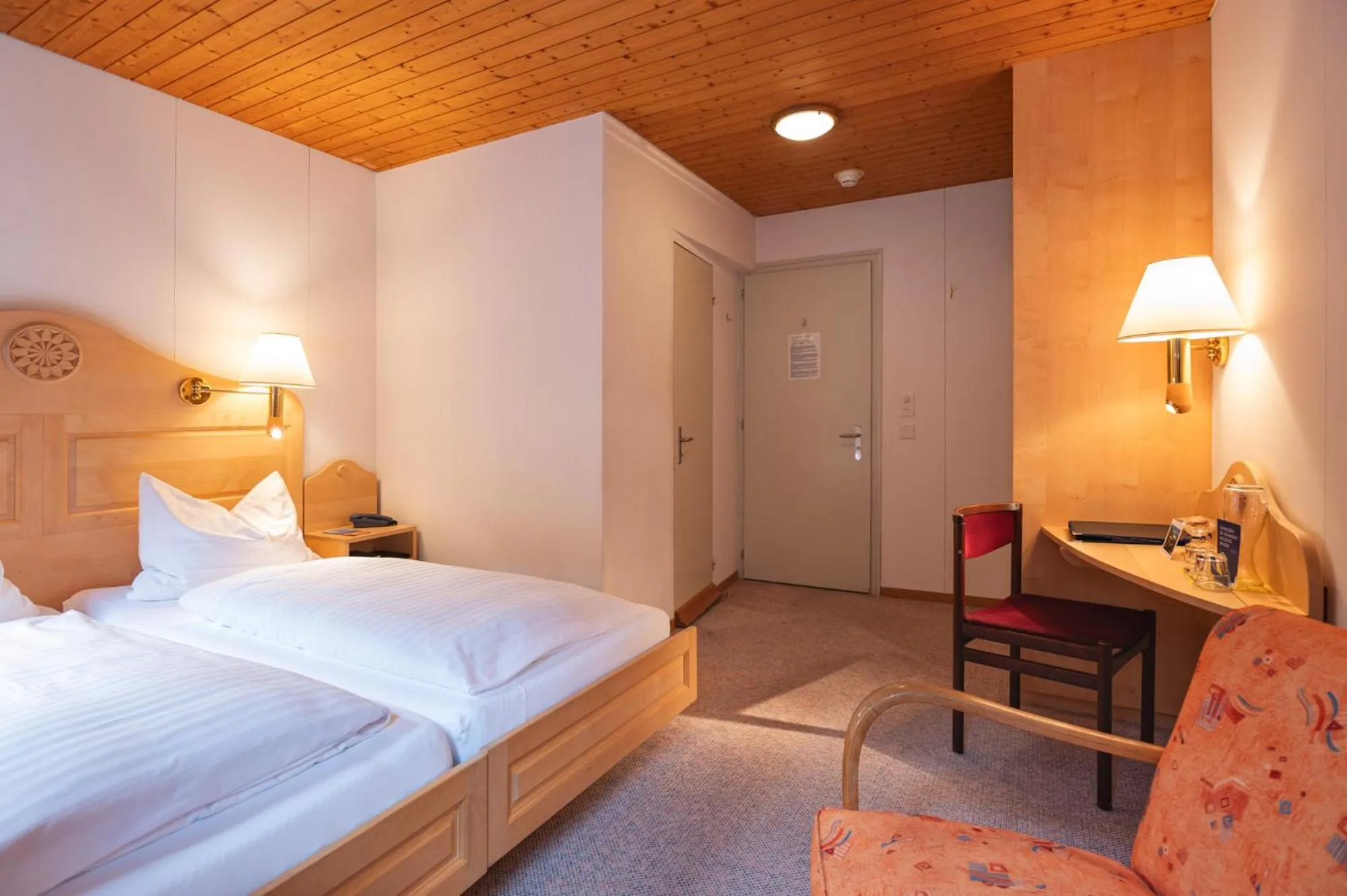 Bed in Hotel Bellevue - Traditional Swiss Hideaway