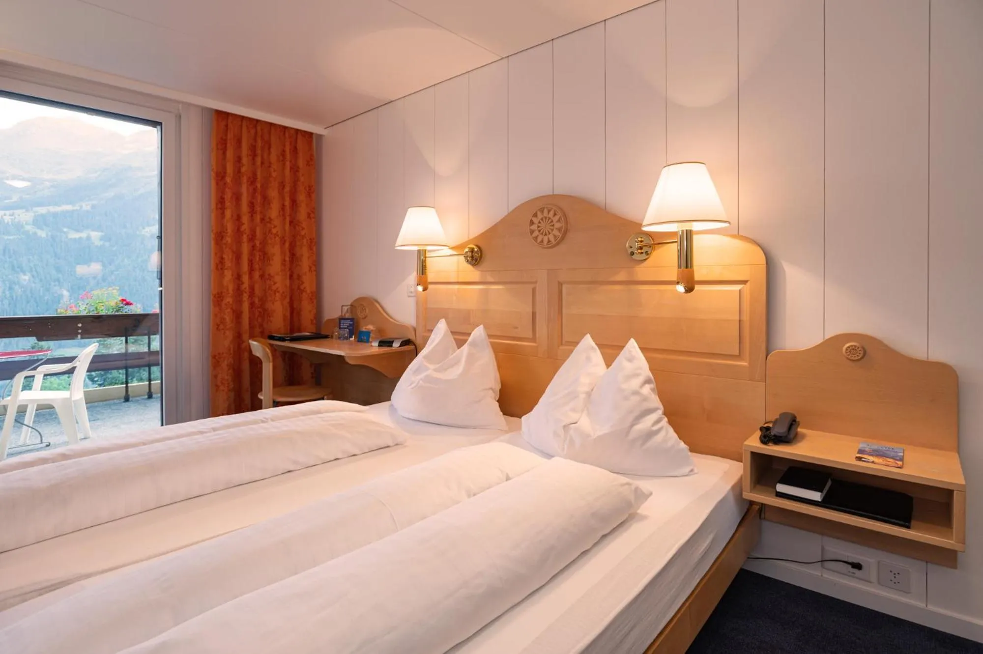 Bed in Hotel Bellevue - Traditional Swiss Hideaway