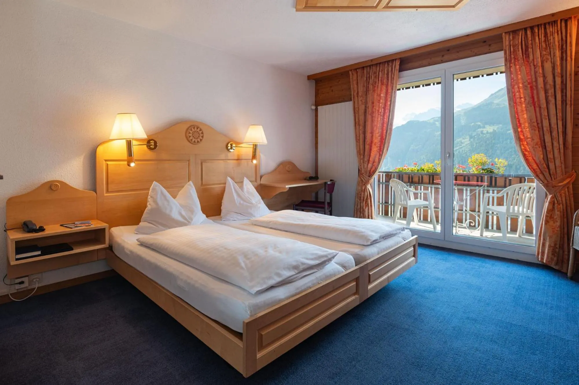 Bed in Hotel Bellevue - Traditional Swiss Hideaway