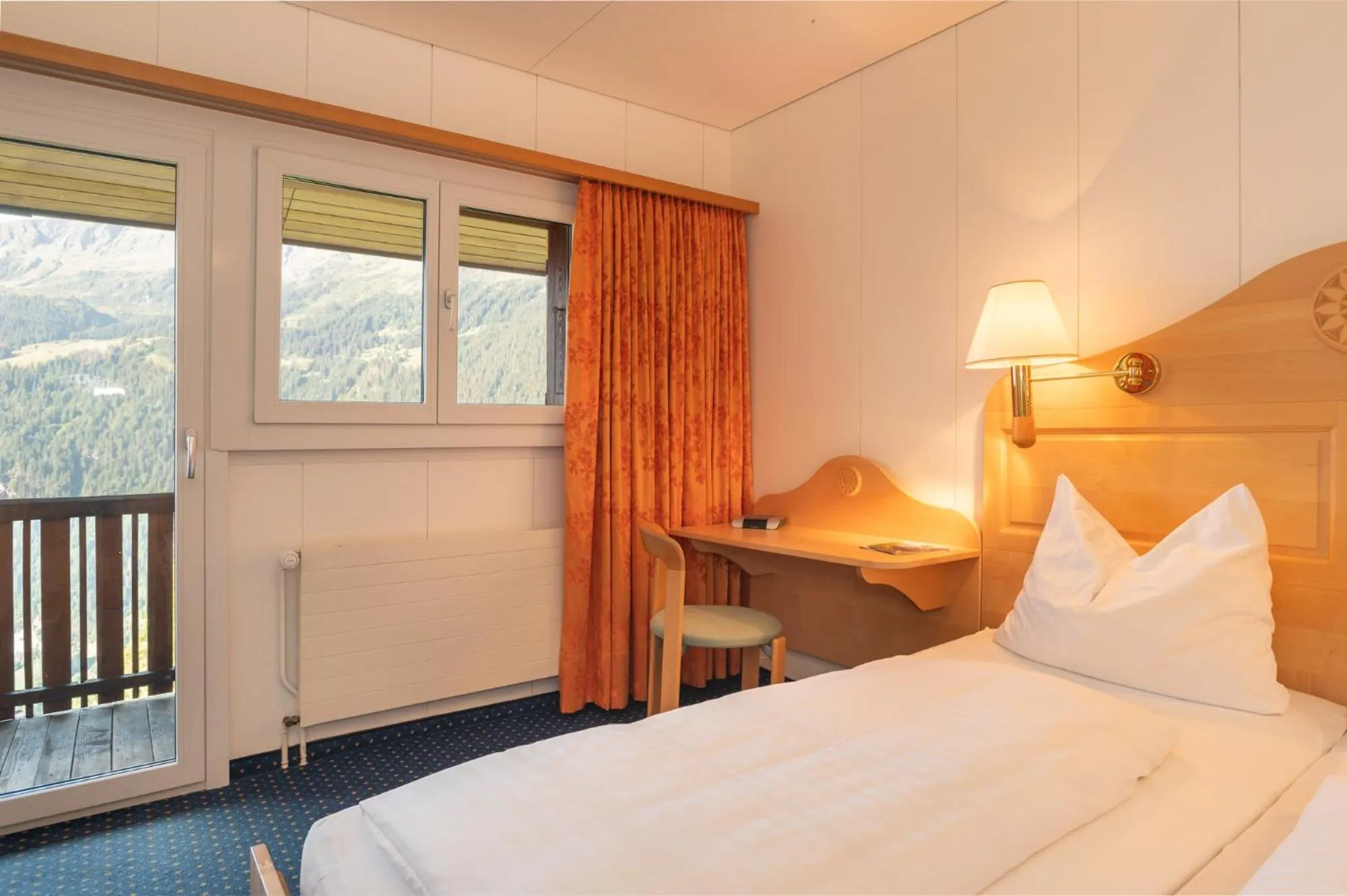 Bed in Hotel Bellevue - Traditional Swiss Hideaway