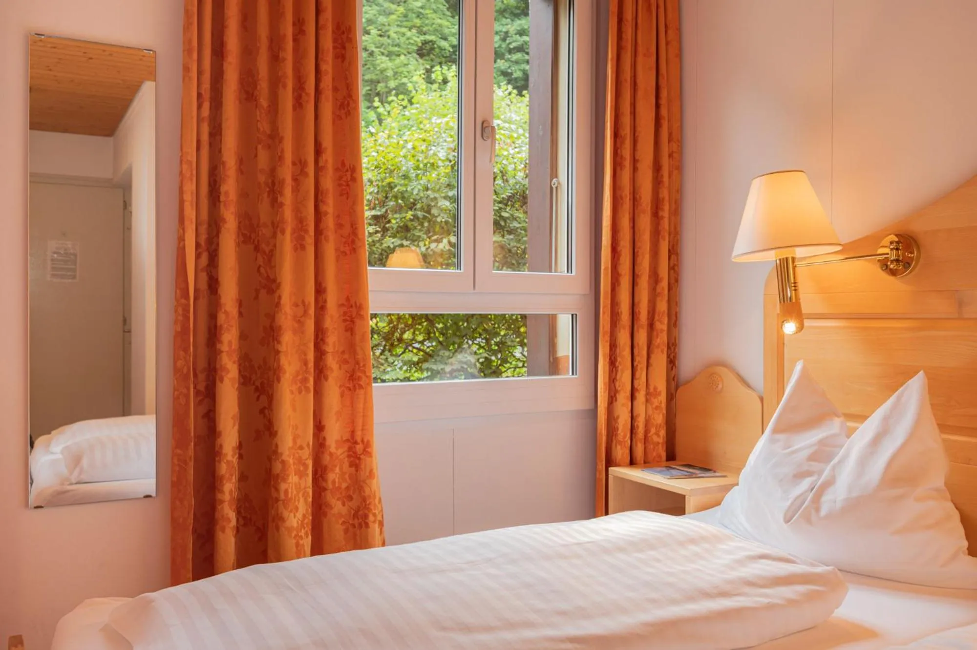 Bed in Hotel Bellevue - Traditional Swiss Hideaway