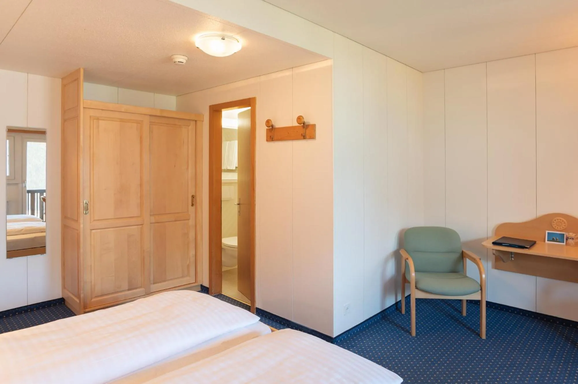 Bed in Hotel Bellevue - Traditional Swiss Hideaway