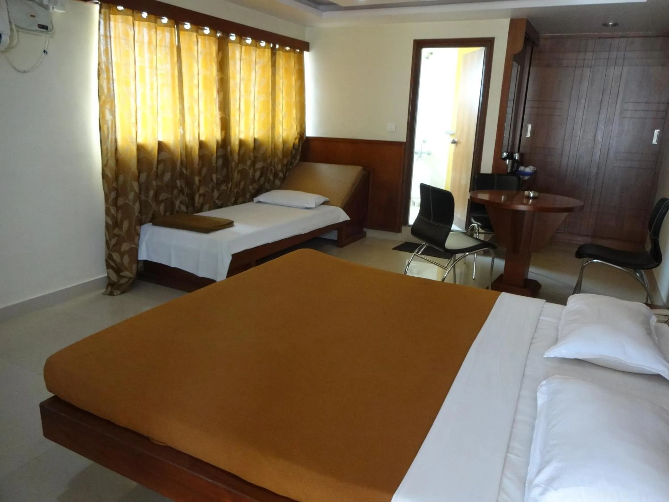 Photo of the whole room, Bed in Sheetal Residency