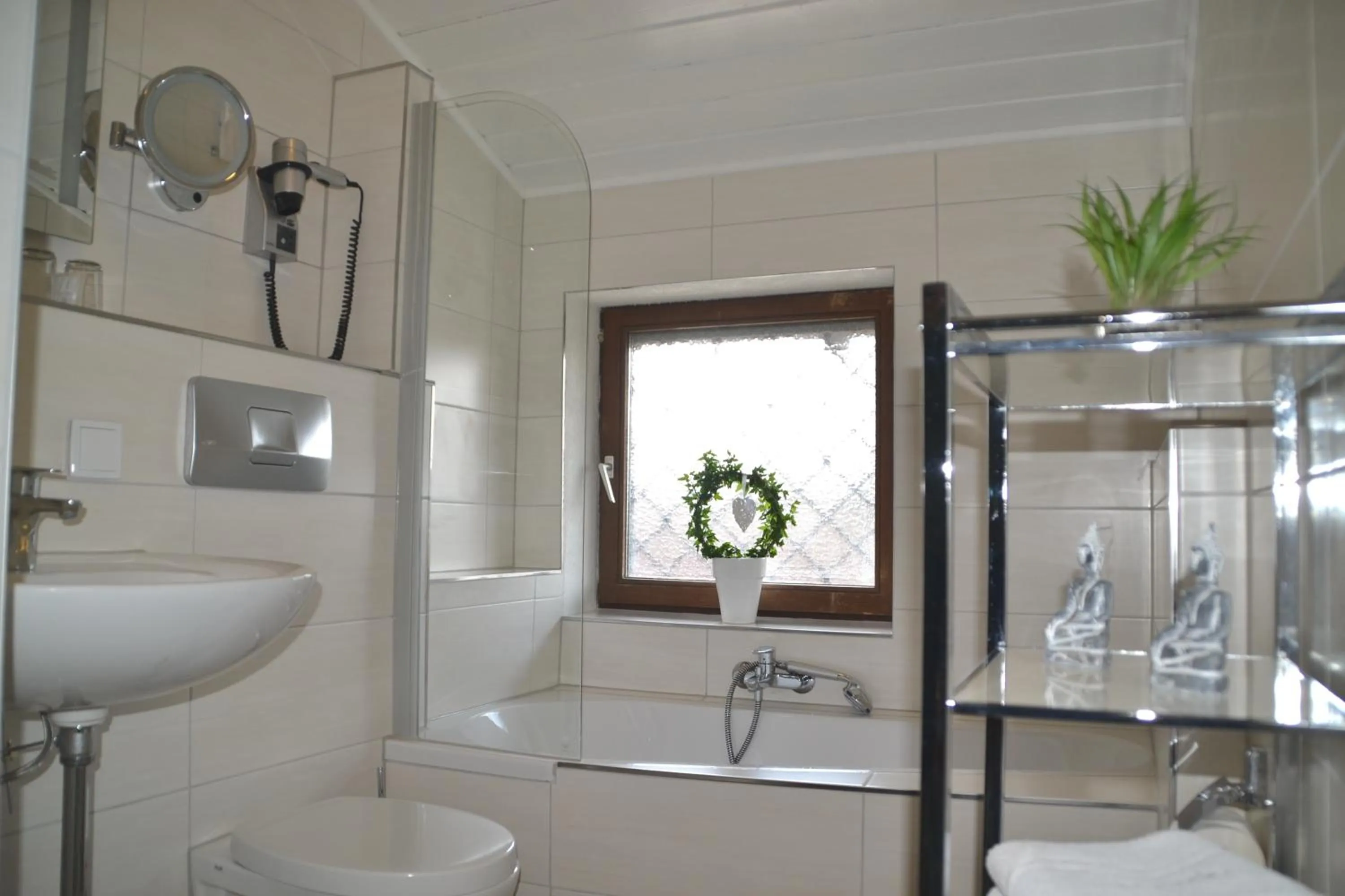 Bathroom in Alpina Hotel