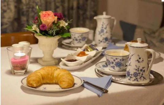 Dining area in Alpina Hotel