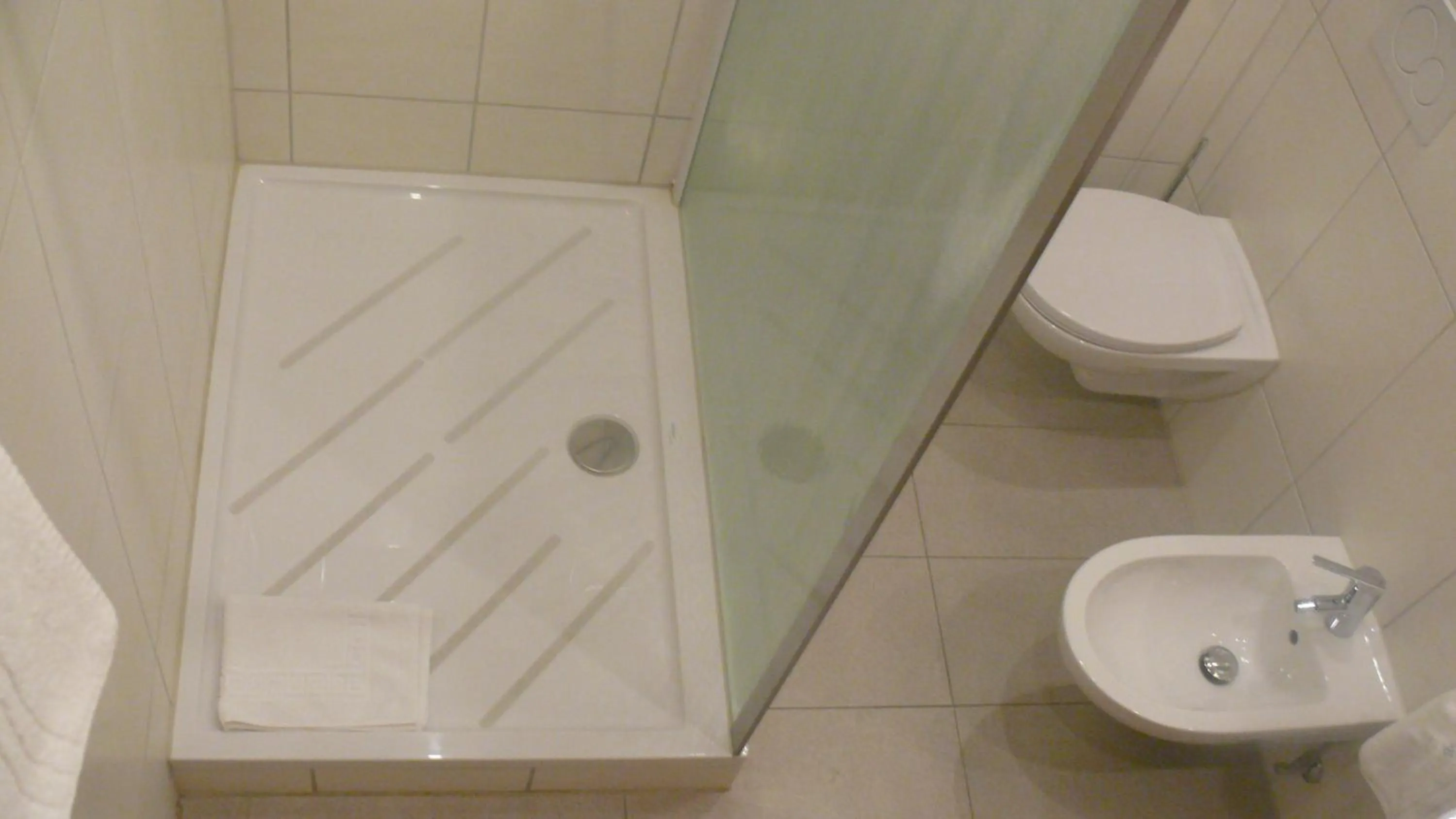 Bathroom in Alpina Hotel