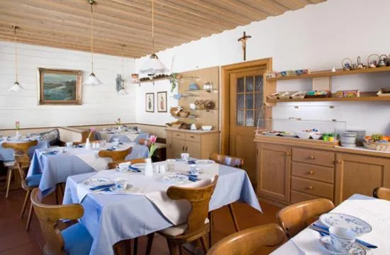 Dining area in Alpina Hotel