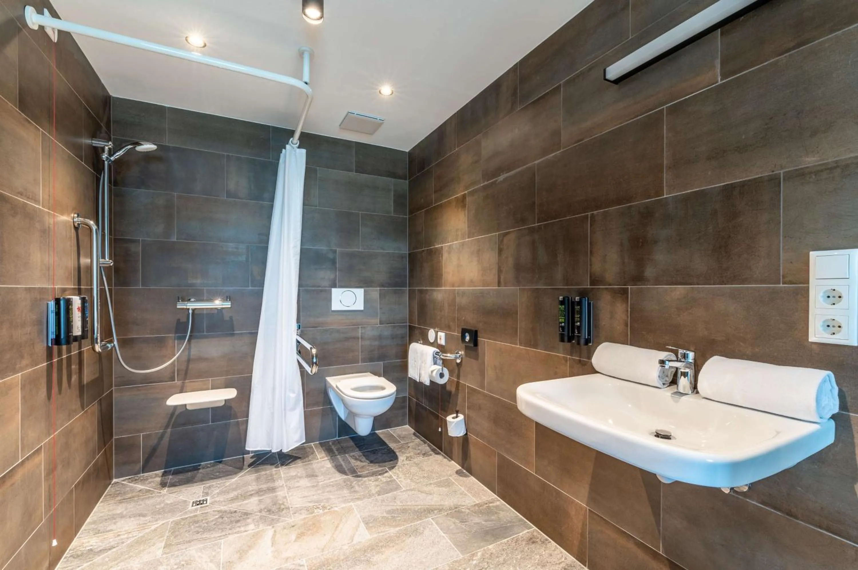 Bathroom in Aiden by Best Western Stadtgut Hotel Steyr - FREE PARKING