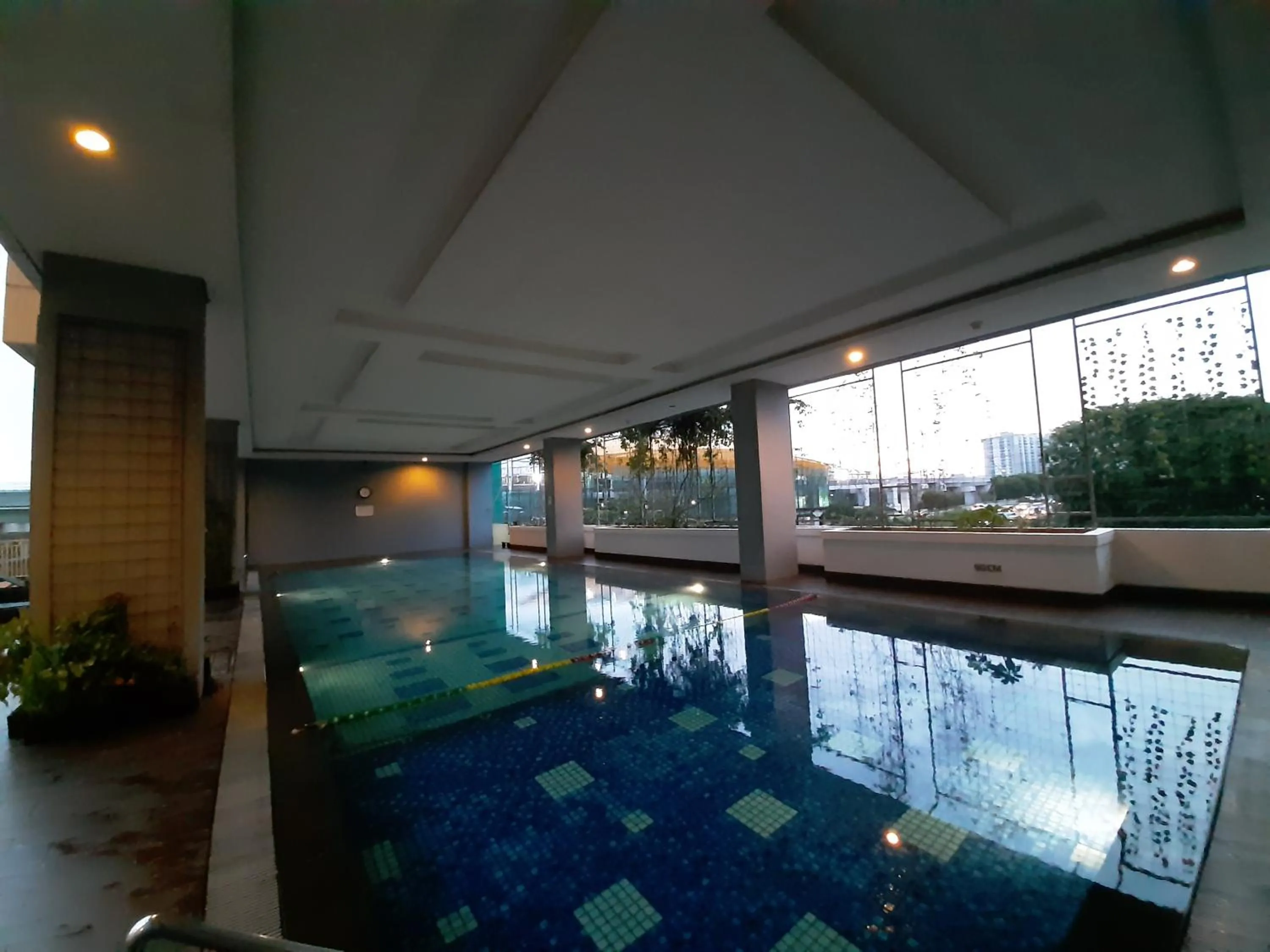 Swimming pool in Cozy The H Residence Cawang by Bonzela Property