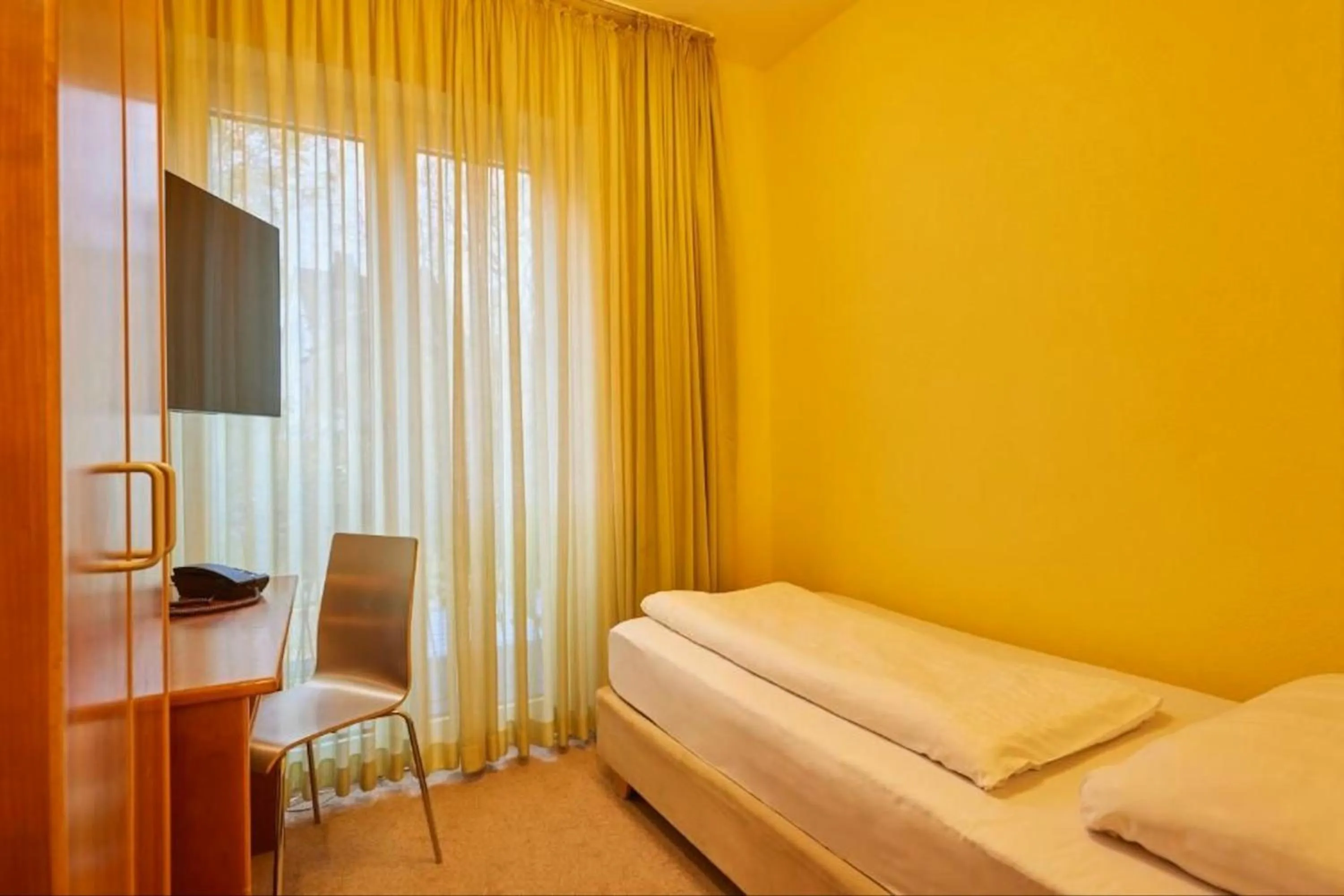 Bed in Classic Hotel Harmonie