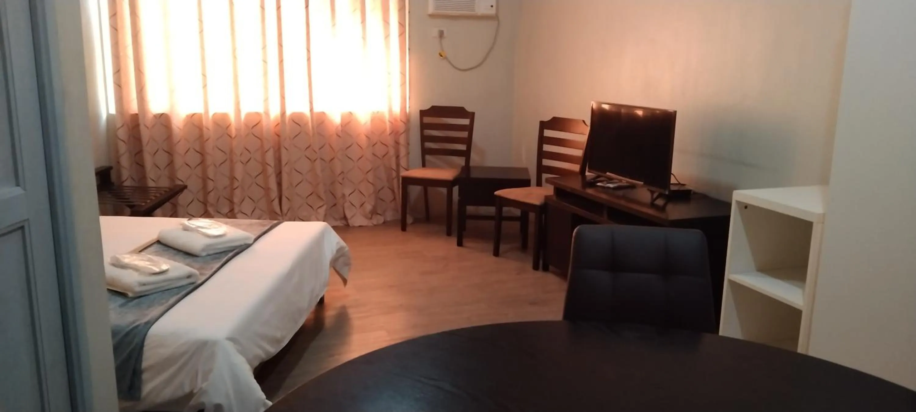 TV/Entertainment Center in White Knight Hotel Saint Anne