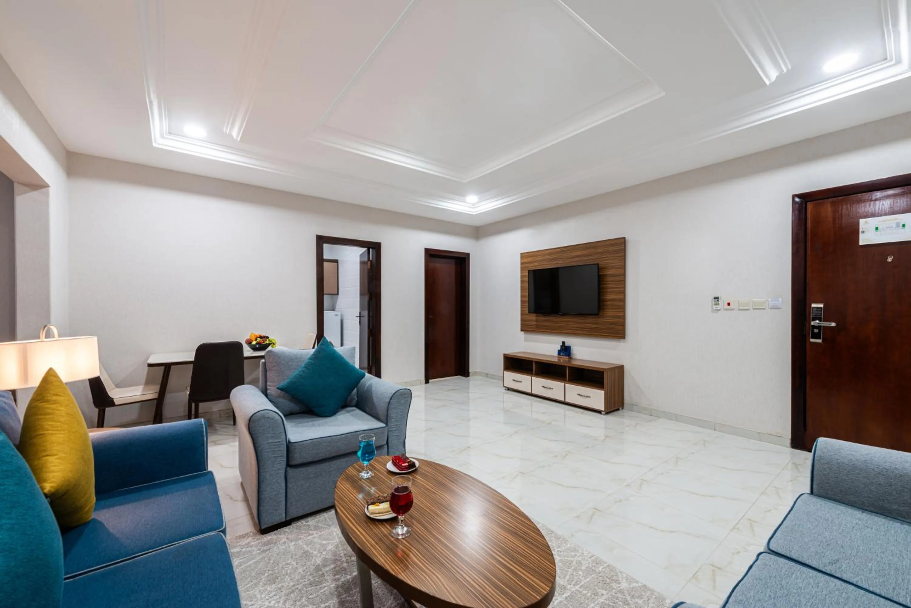 Communal lounge/ TV room in The Palaces Hotel Suites - Wadeen