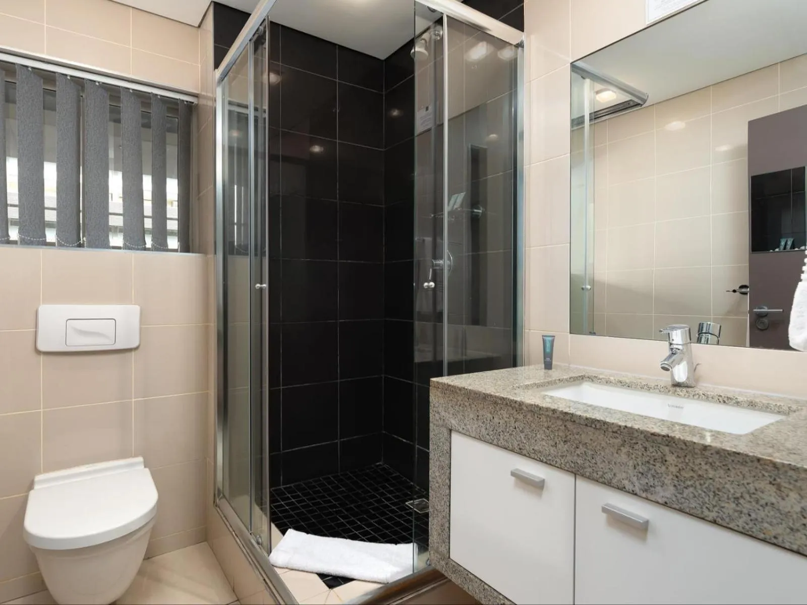 Bathroom in HarbourEdge Suites by Totalstay
