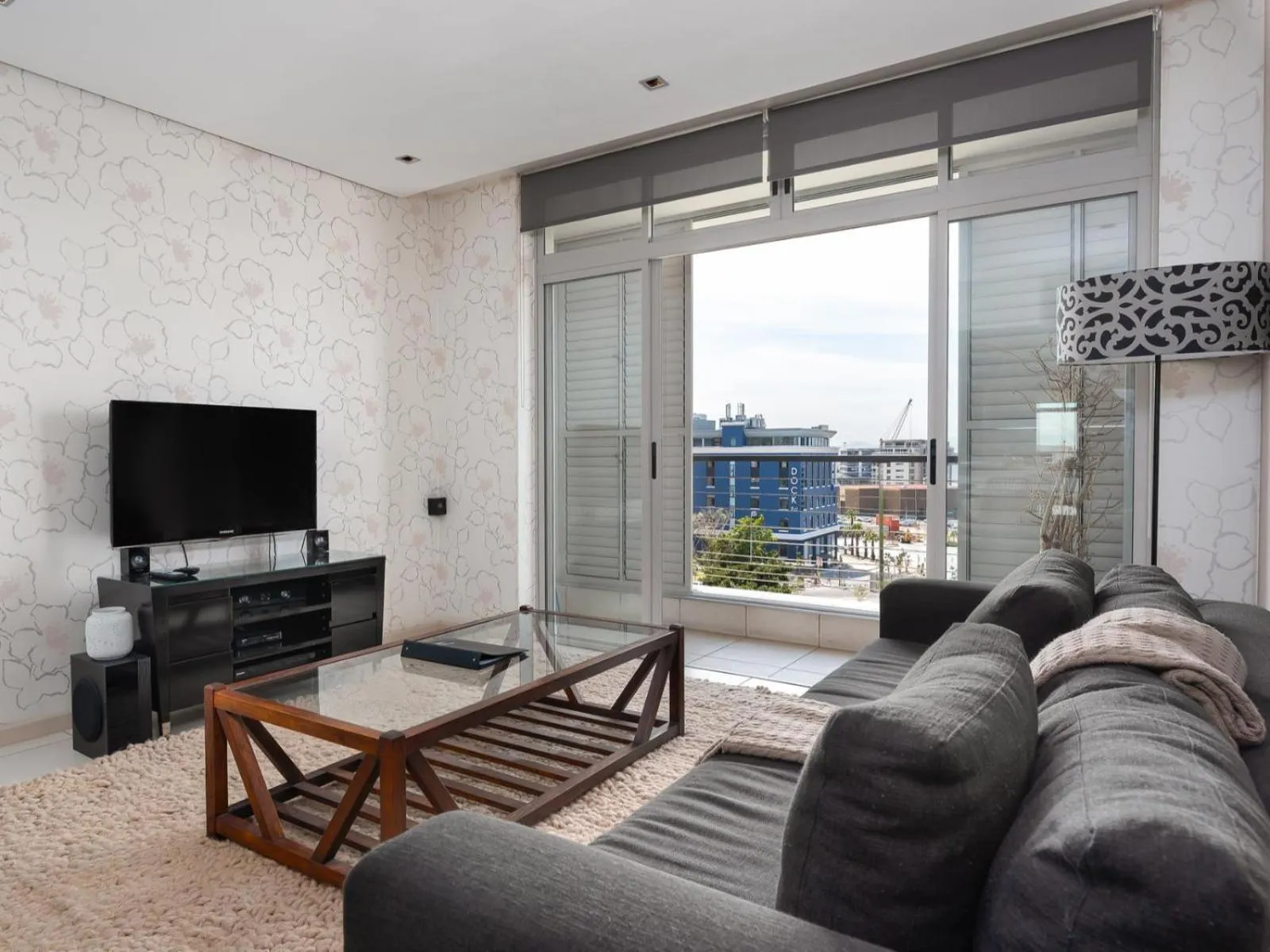 TV and multimedia, Seating Area in HarbourEdge Suites by Totalstay