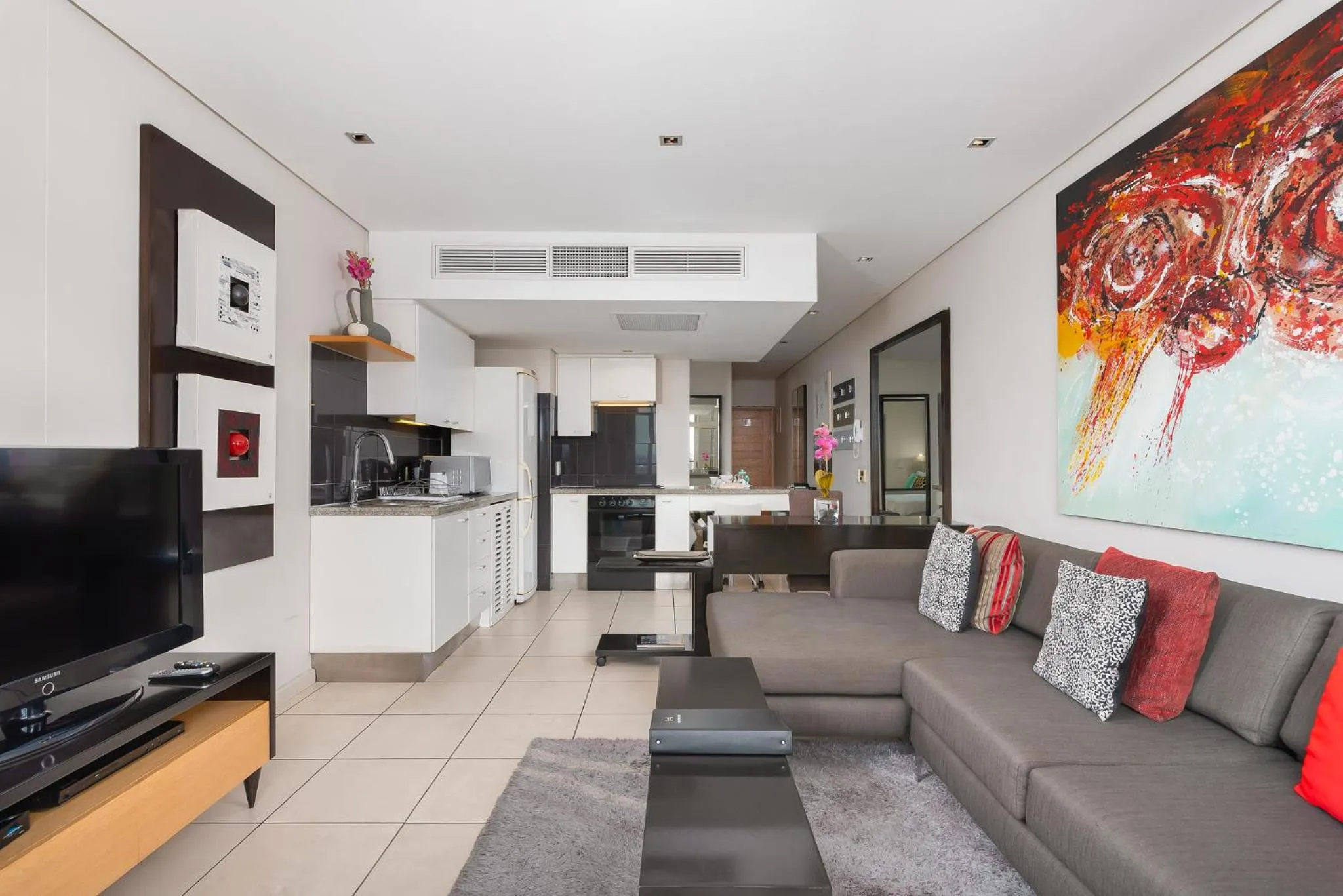 TV and multimedia, Seating Area in HarbourEdge Suites by Totalstay