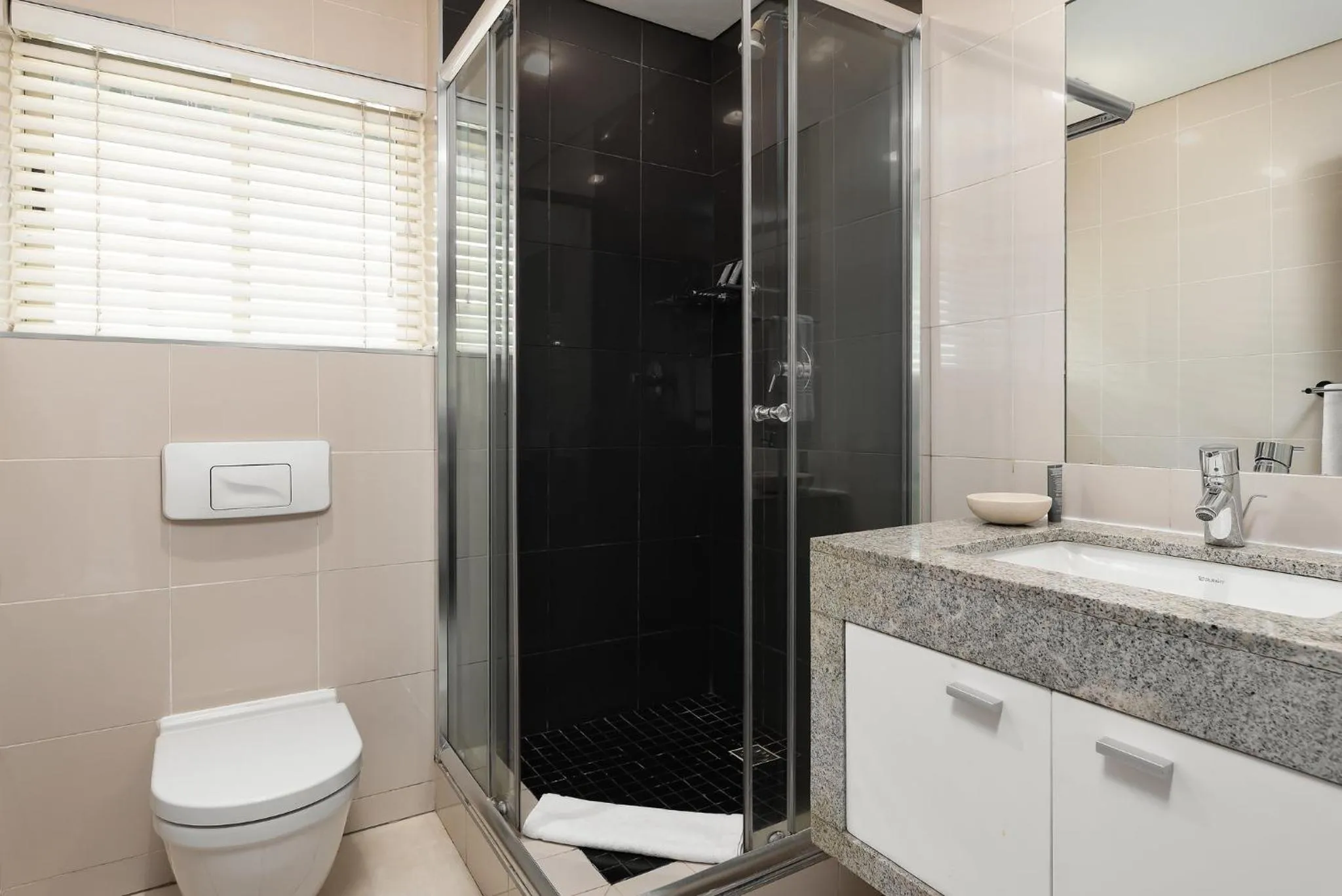 Bathroom in HarbourEdge Suites by Totalstay