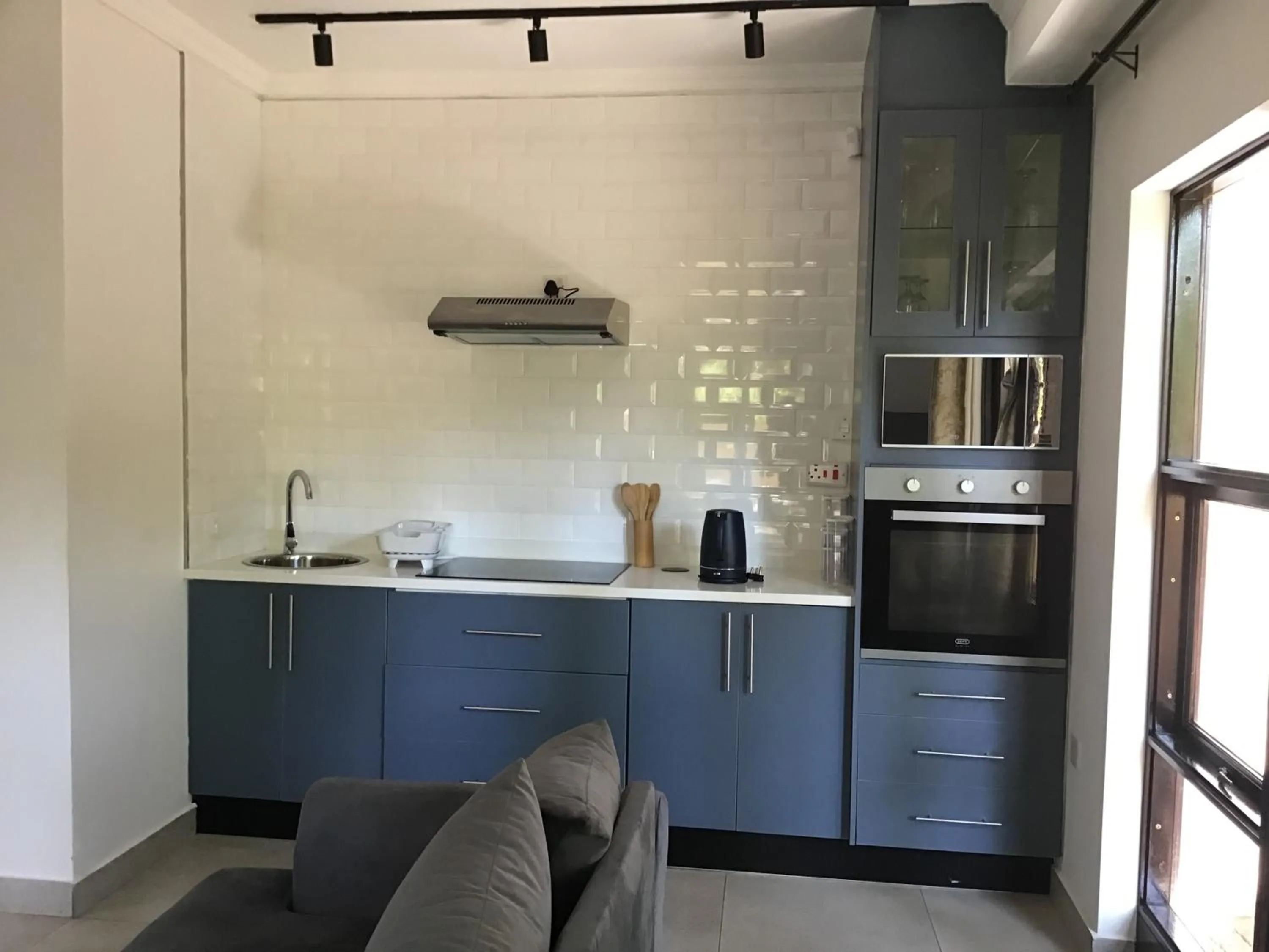 Kitchen or kitchenette in The Capital Guest House