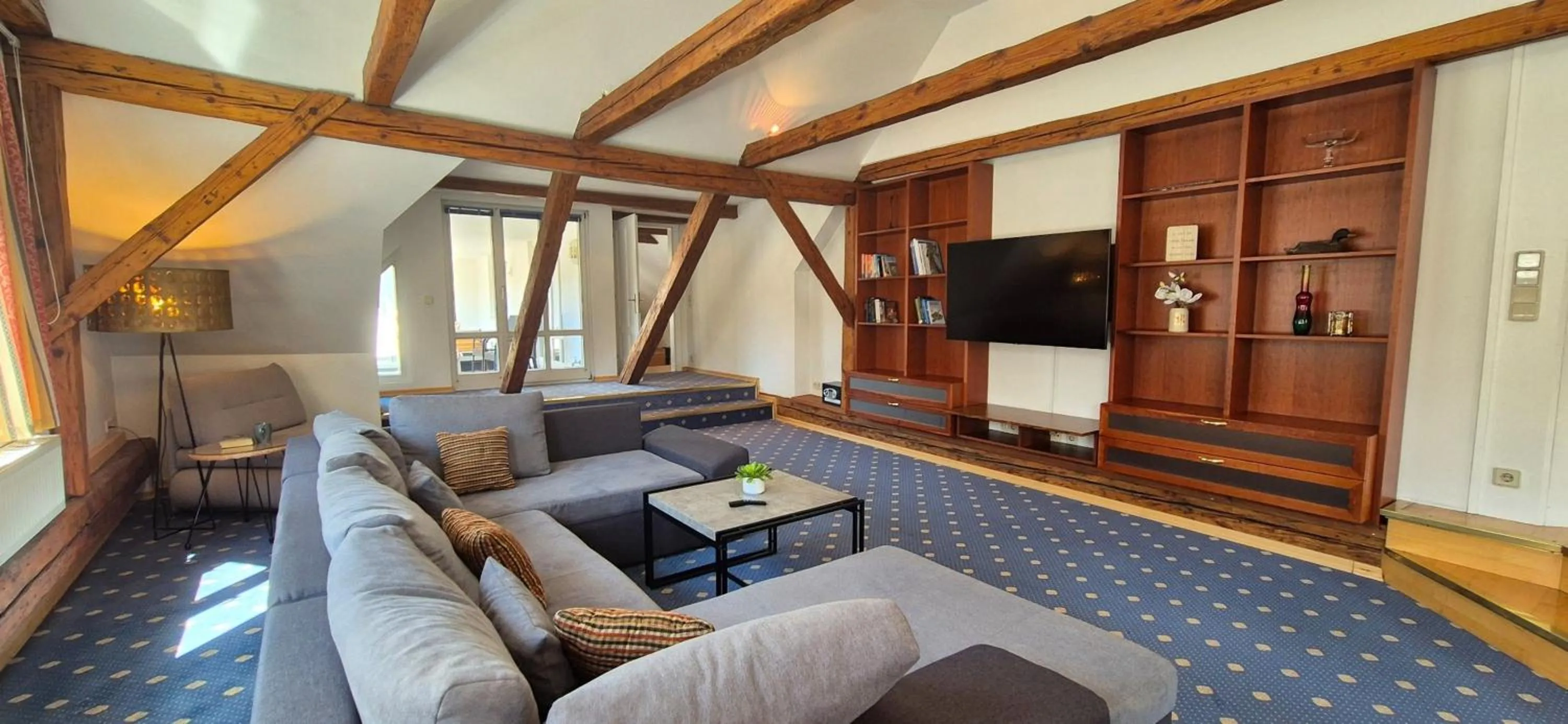 Communal lounge/ TV room in Stadthotel Kramer