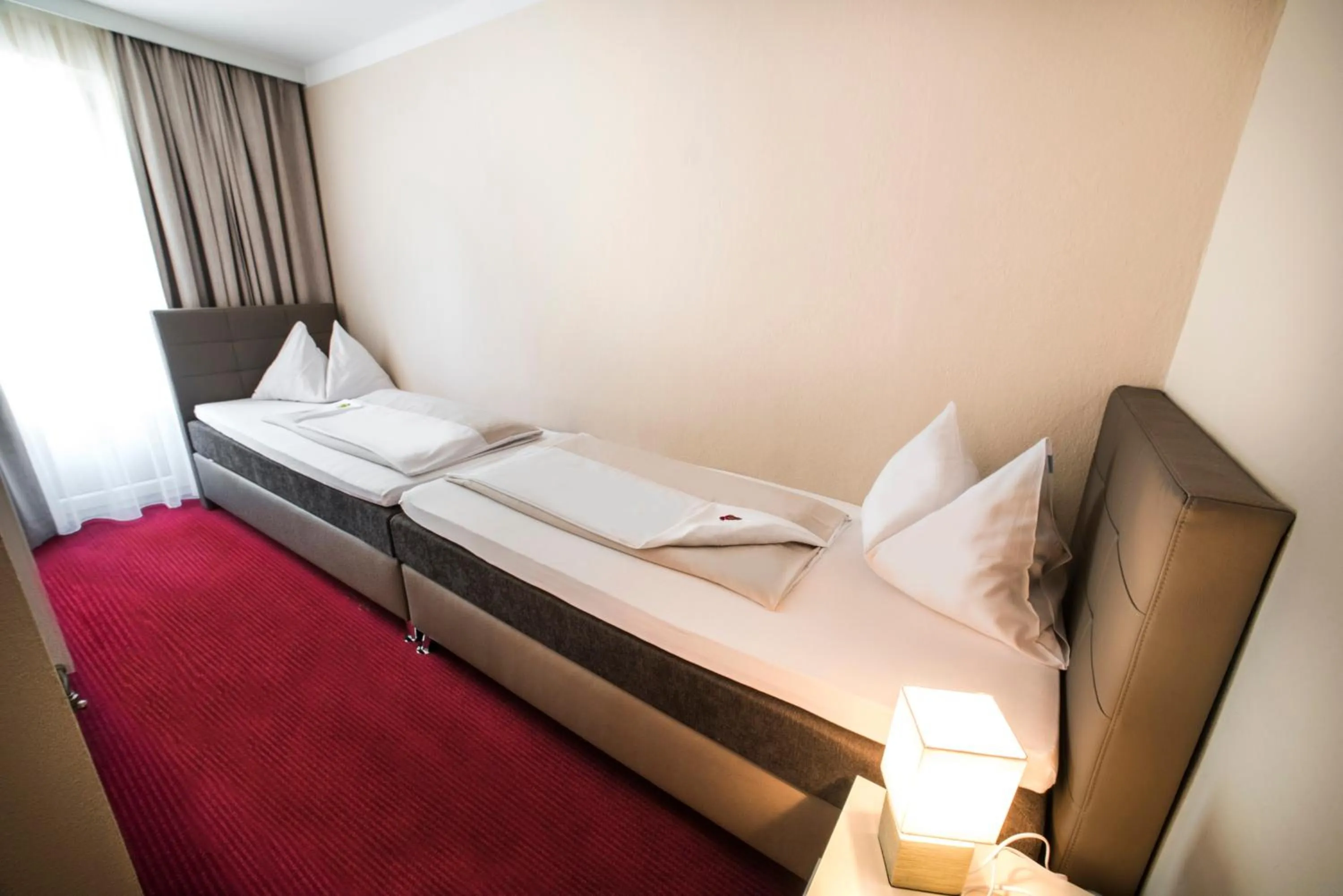 Bed in Stadthotel Kramer