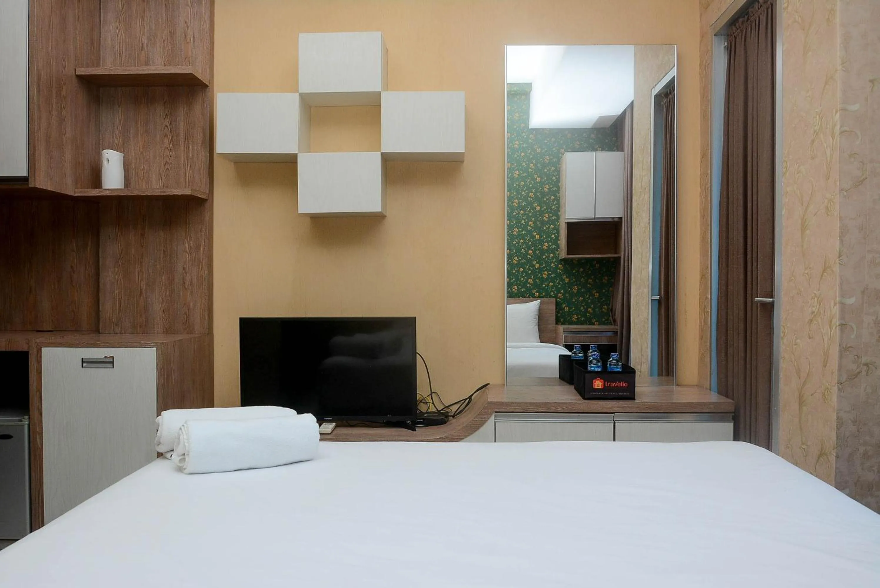 Bed in Gorgeous and Strategic Studio Apartment at Capitol Park Residence By Travelio