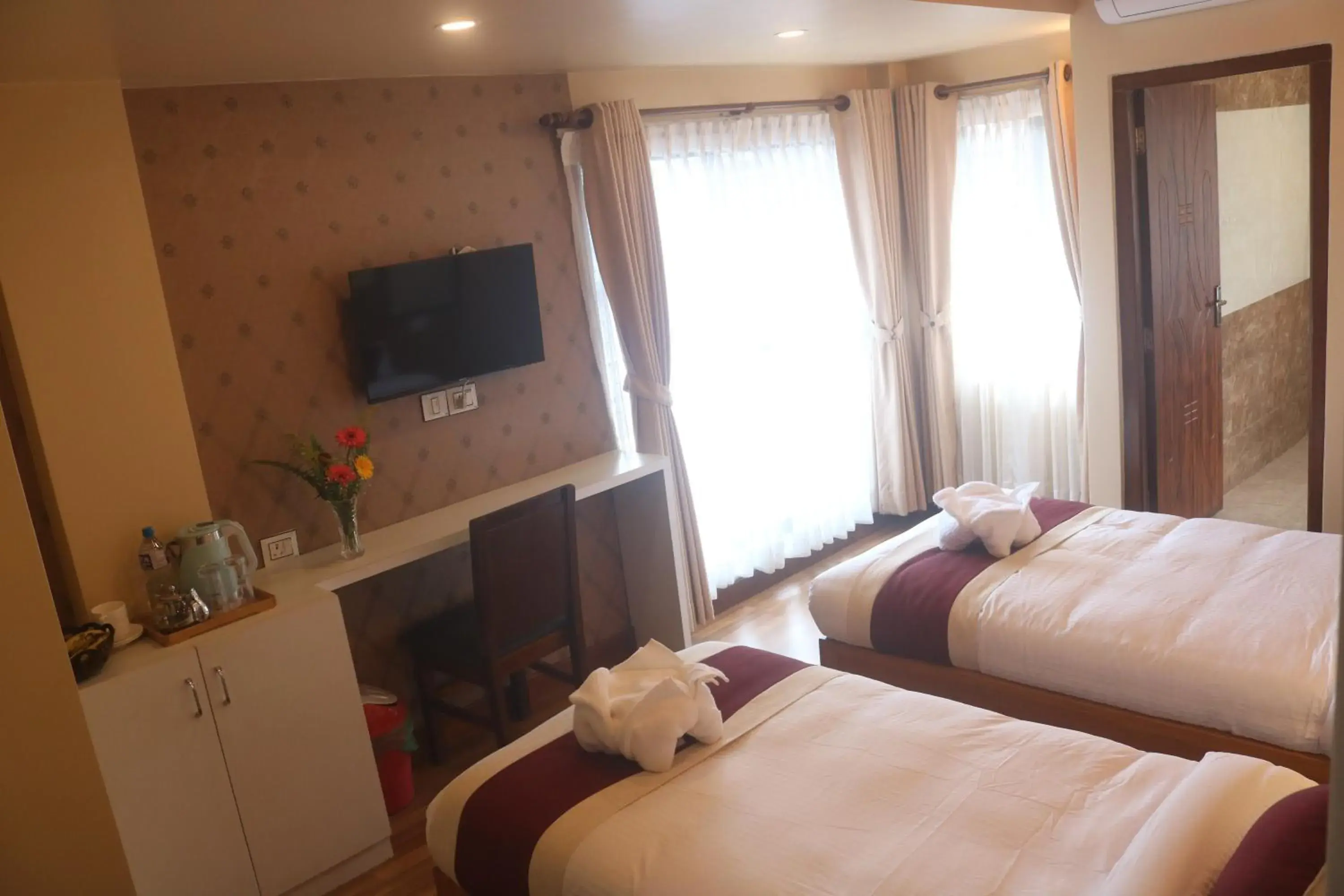 Triple Room with Balcony in Hotel Family Ties Pvt. Ltd. Triple Room with Balcony in Hotel Family Ties Pvt. Ltd.