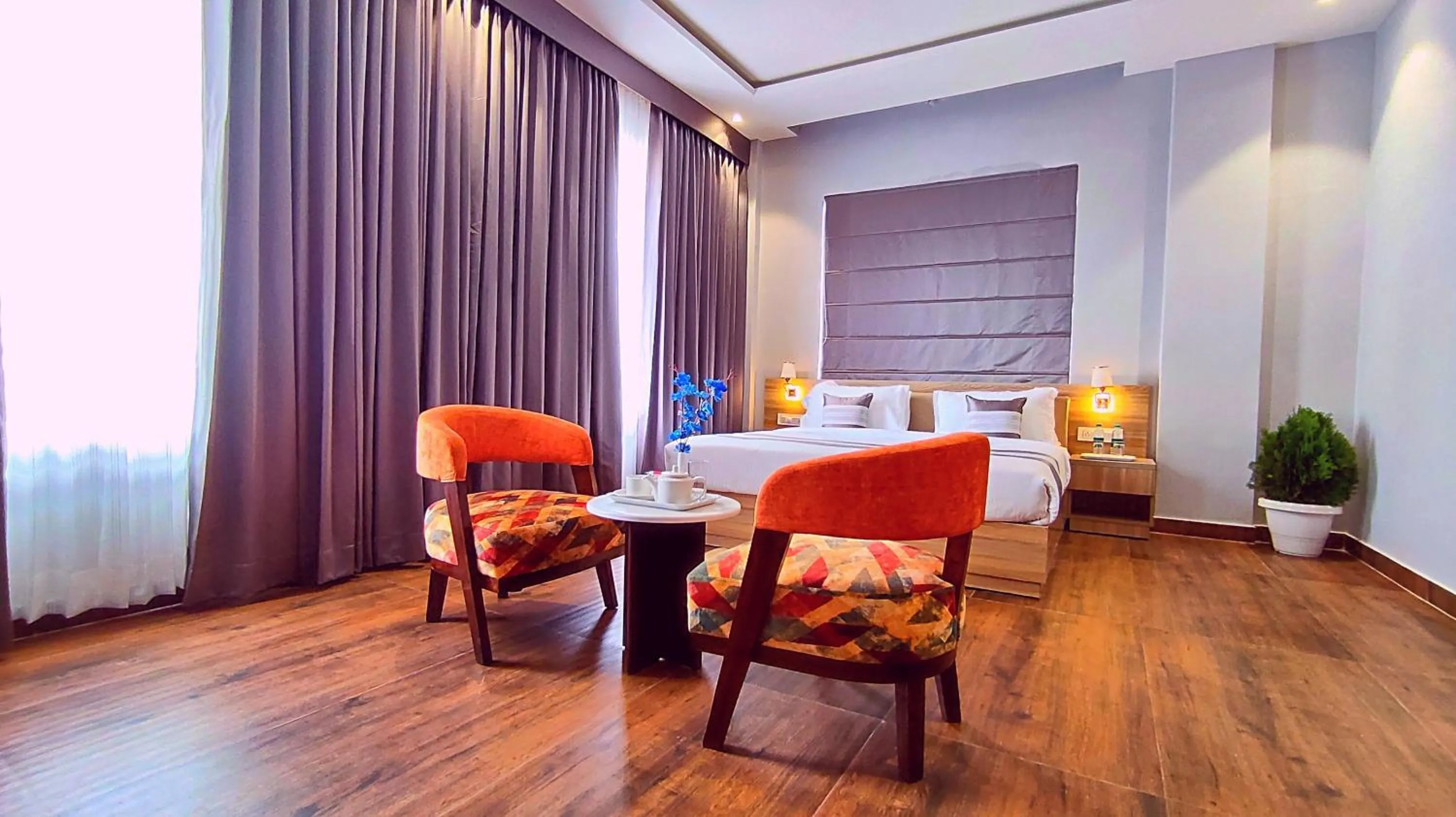 Seating area, Bed in ShriGo Hotel Nathdwara