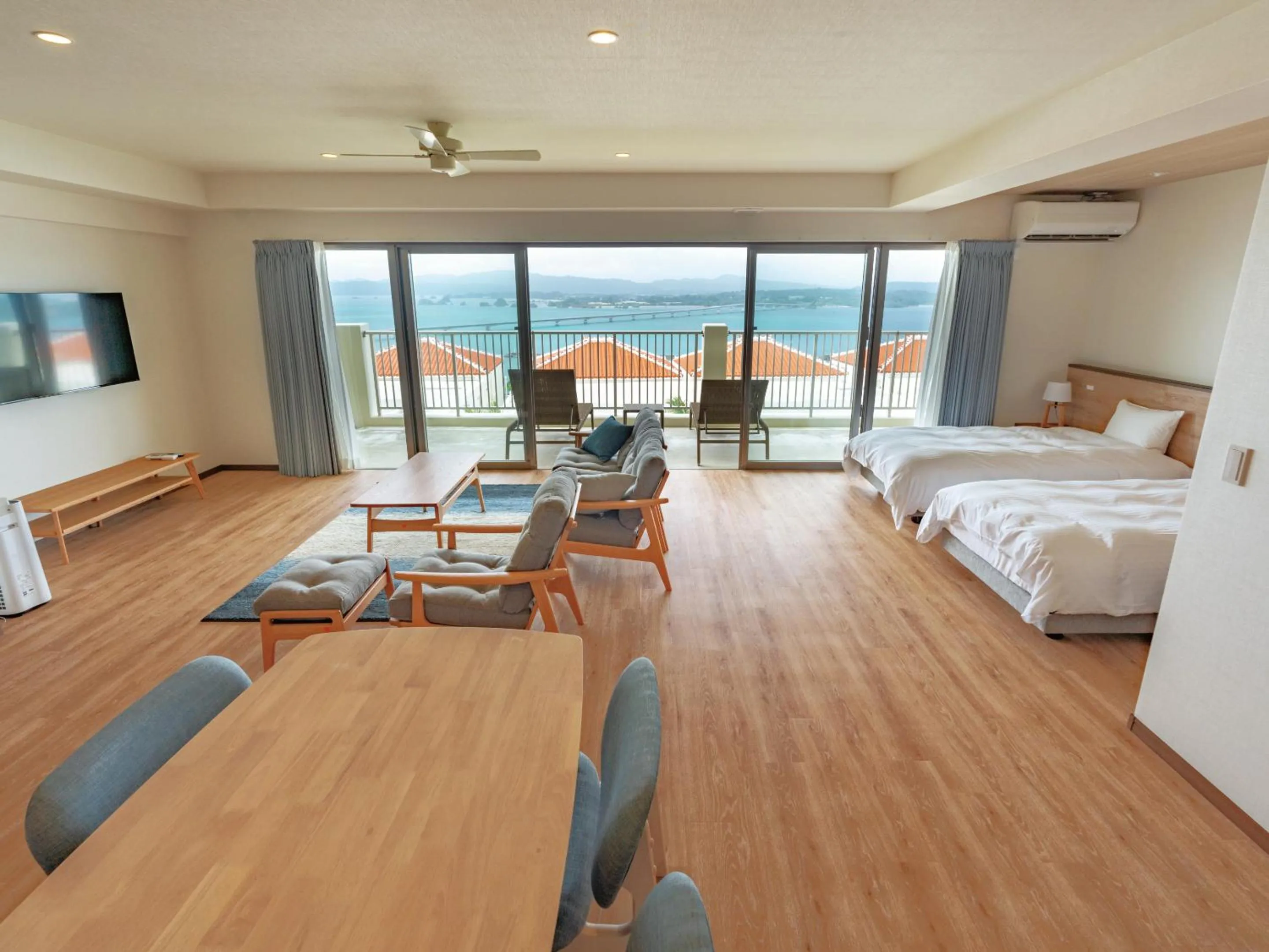 Living room, Bed in Private condo Kourijima by Coldio Smart Resort