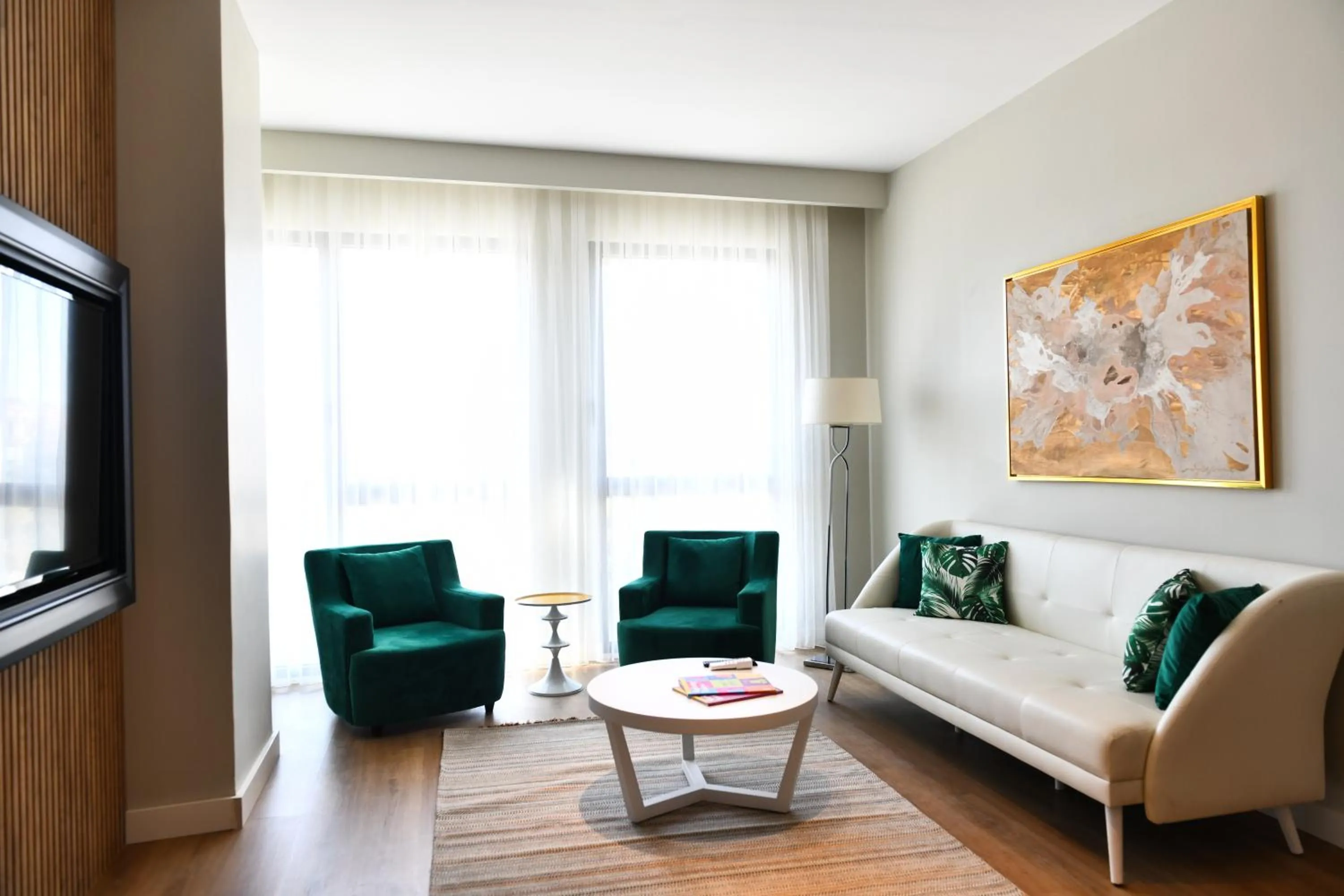 Communal lounge/ TV room in G Tower Furnished Apartment Rentals